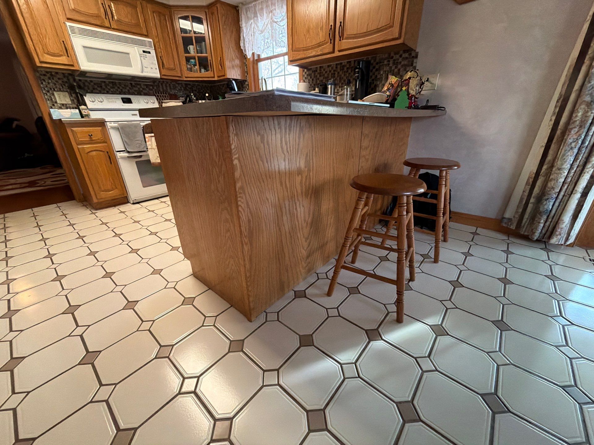 Kitchen Cabinet Painting and Hardware Update in Sioux Falls by Select Painting, Coatings & Garage Cabinets