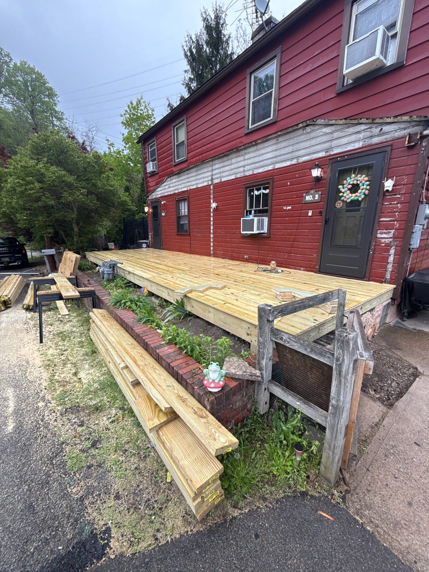 Roof sunspace deck  by Cousins Roofing Siding & Decks