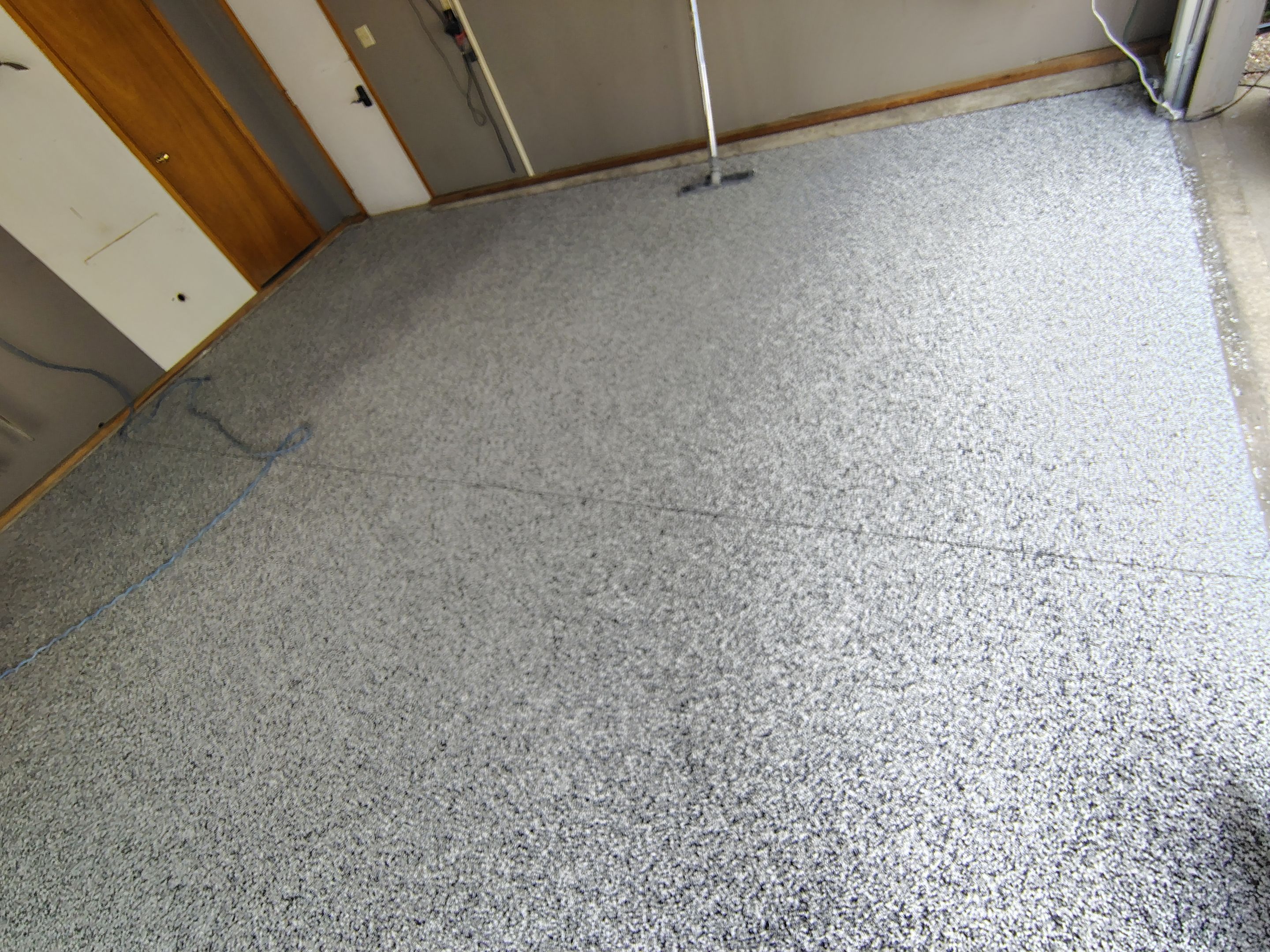 Garage Floor Concrete Coating and Crack Repair in Sioux Falls by Select Painting, Coatings & Garage Cabinets