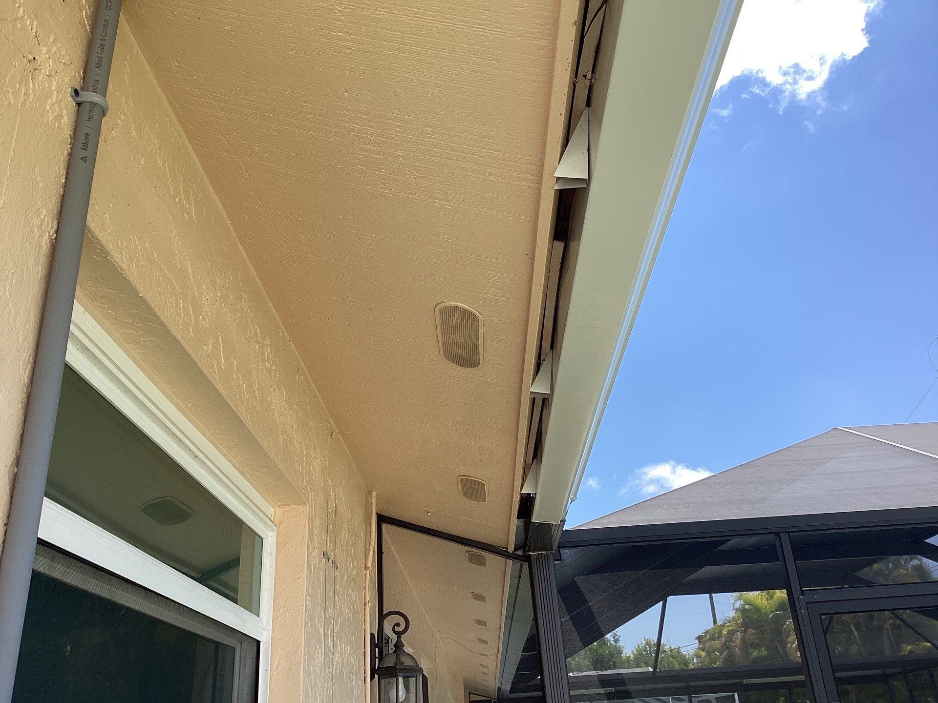 White K Style Seamless Gutters using 3X4 Elbow Downspout in Cape Coral FL by Gutter Professors