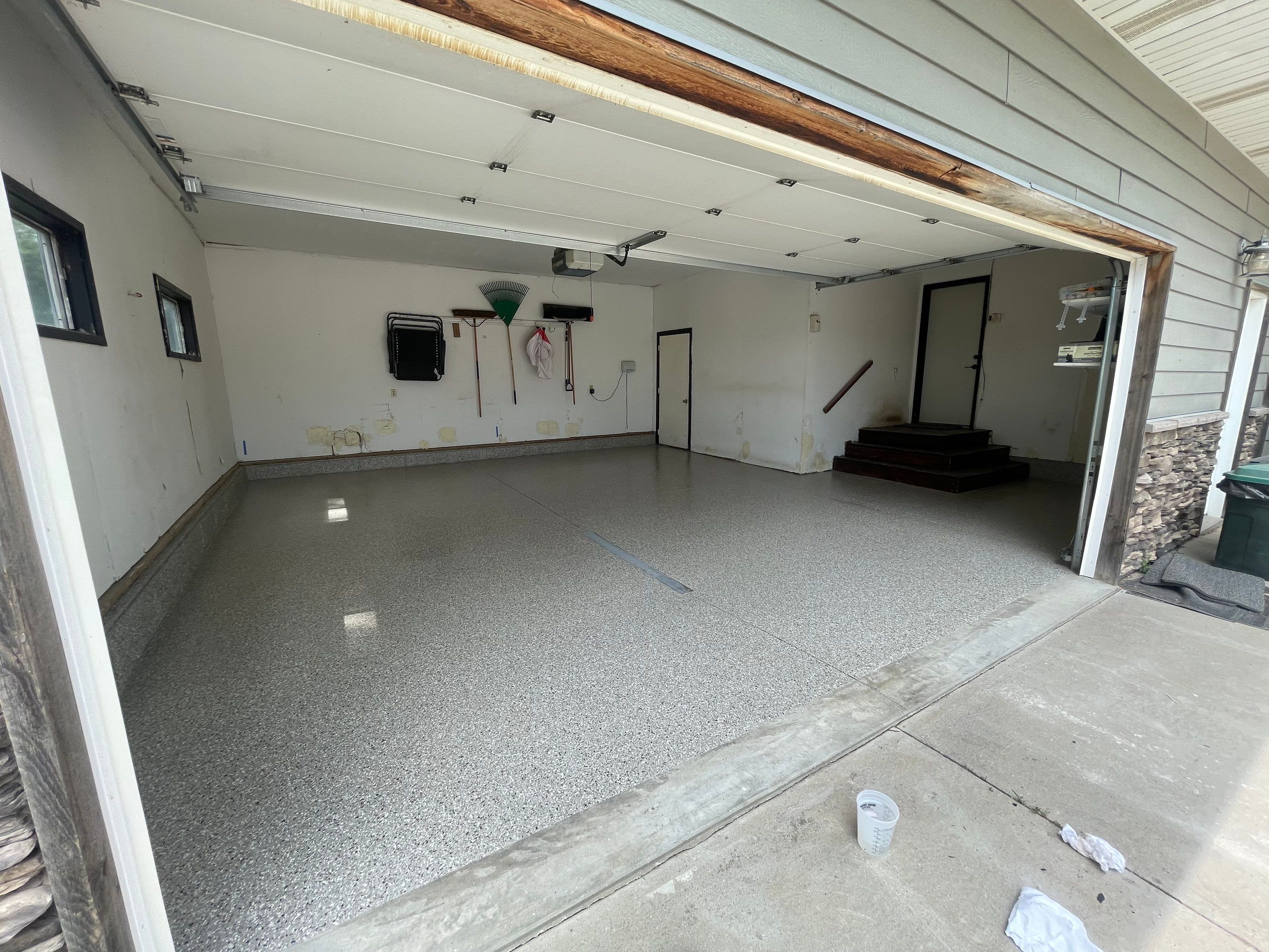 Hartford Residential Garage Floor Transformation With Decorative Chip Coating by Select Painting, Coatings & Garage Cabinets