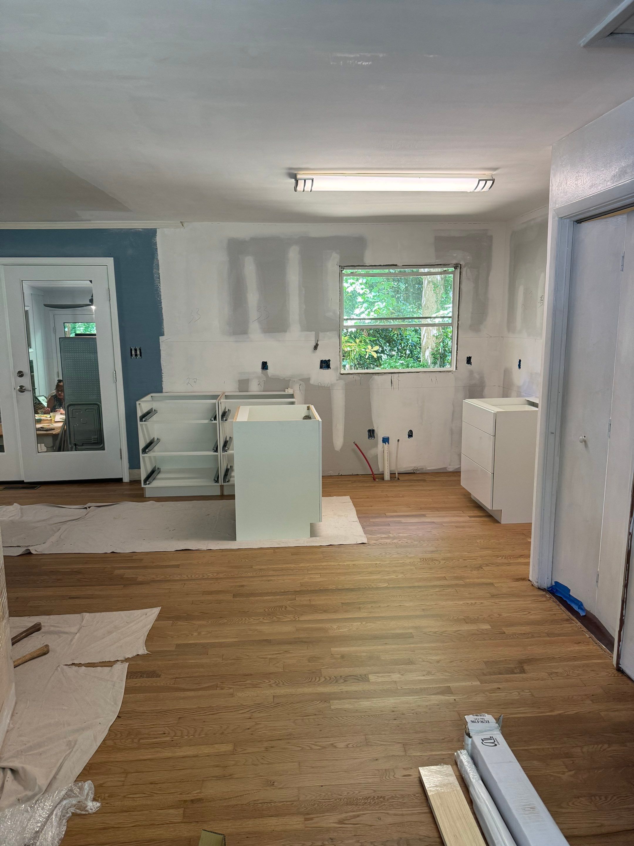 Modern Kitchen Remodeling with Large Central Island in Doraville by Swift Home Renovations