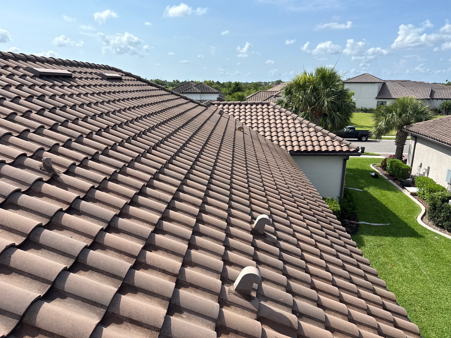 Soft Wash Roof Cleaning – Concrete Tile Roof | Artisan Lakes Esplanade, Palmetto, FL by Sunshine AquaWash