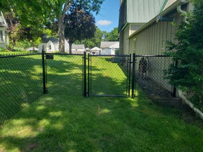 Black Chain Link Perimeter Fence and Driveway Gate in Waverly