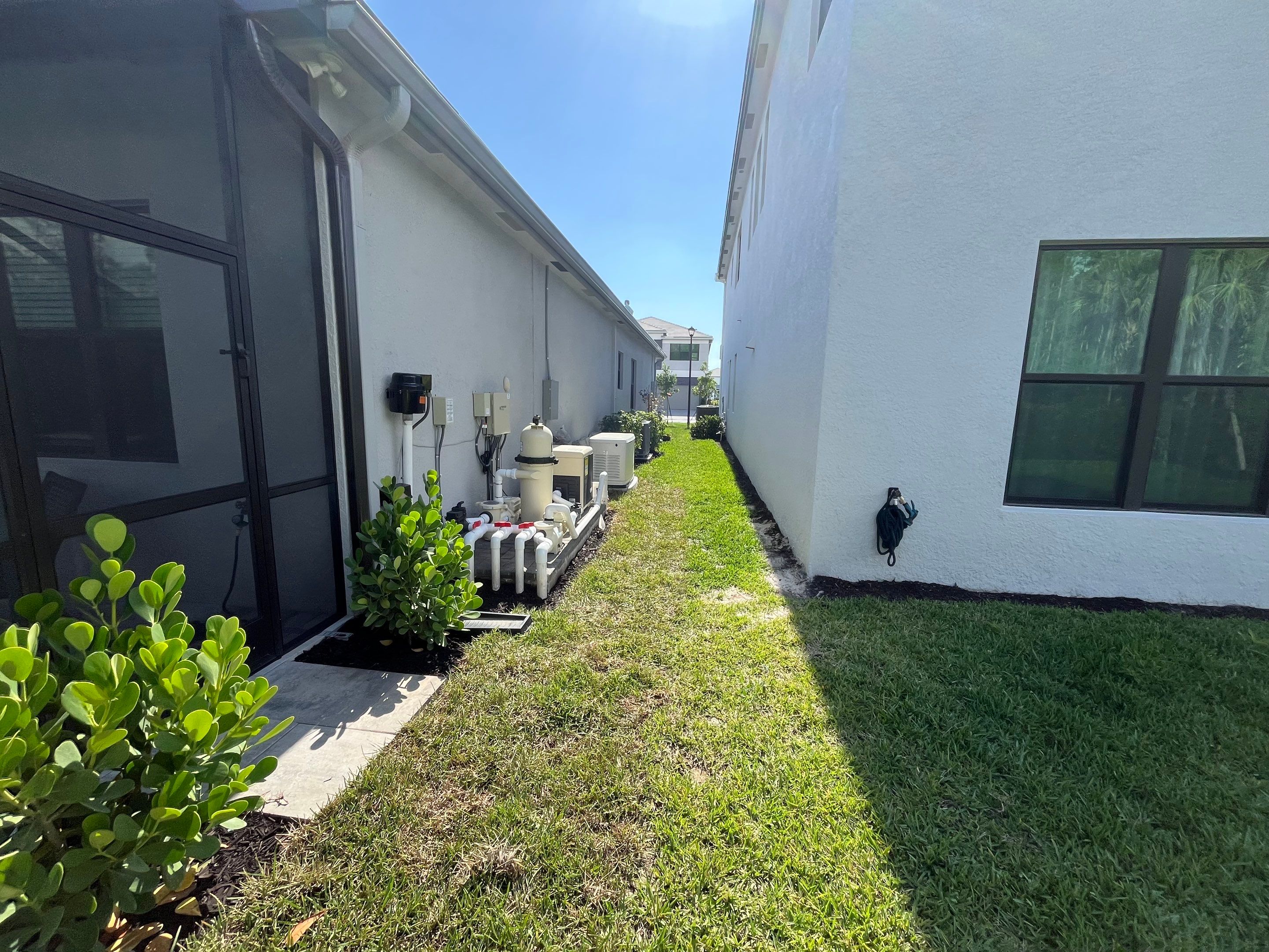 Grey Seamless Gutter Installation in Estero FL by Gutter Professors