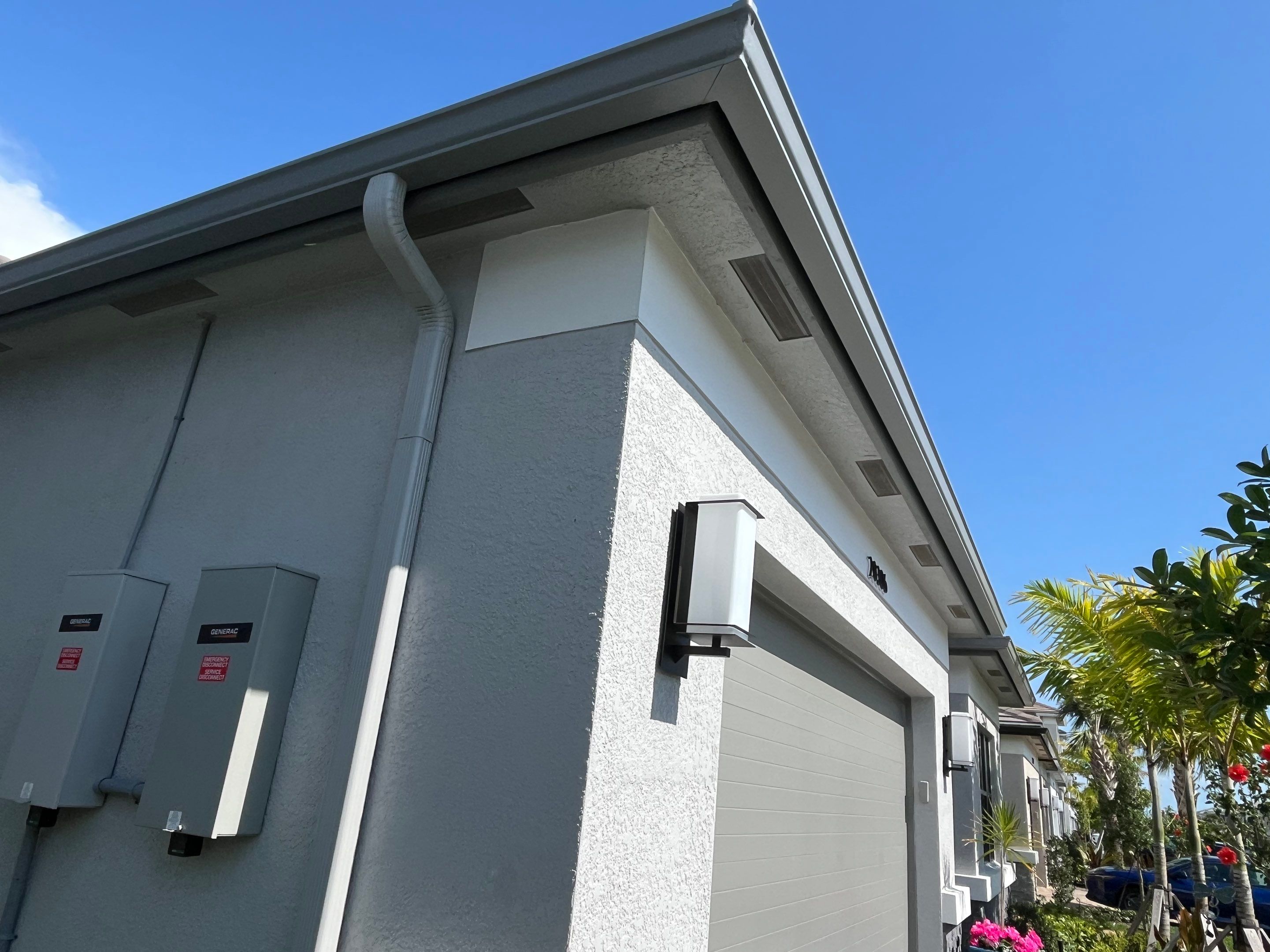 Grey Seamless Gutter Installation in Estero FL by Gutter Professors