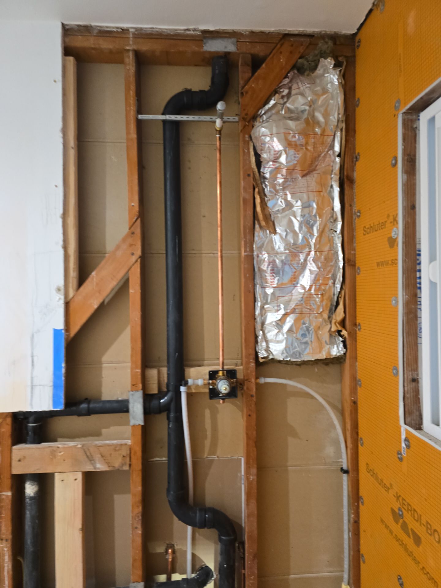 Installation of New Tall Black Piping (Wall to Ceiling) & Underground Piping by Us Plumbing