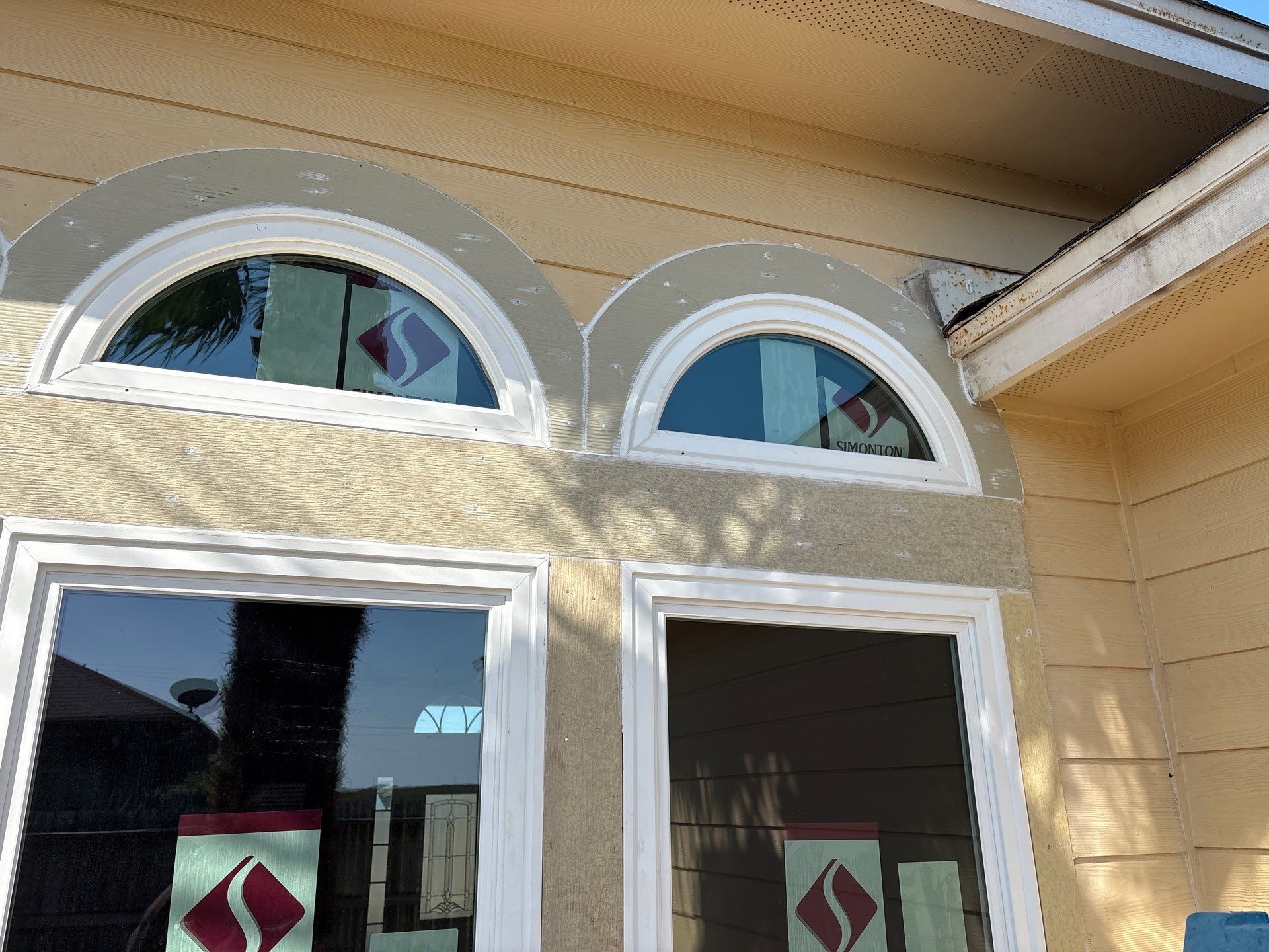 Curved Trim Windows by Bayfront Roofing and Construction