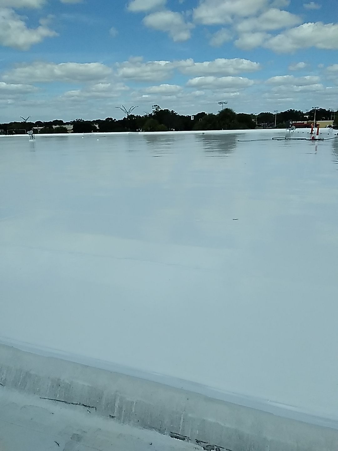 Silicone Roof Coating and Parapet Wall Repairs in South Bradenton by CES Roofing