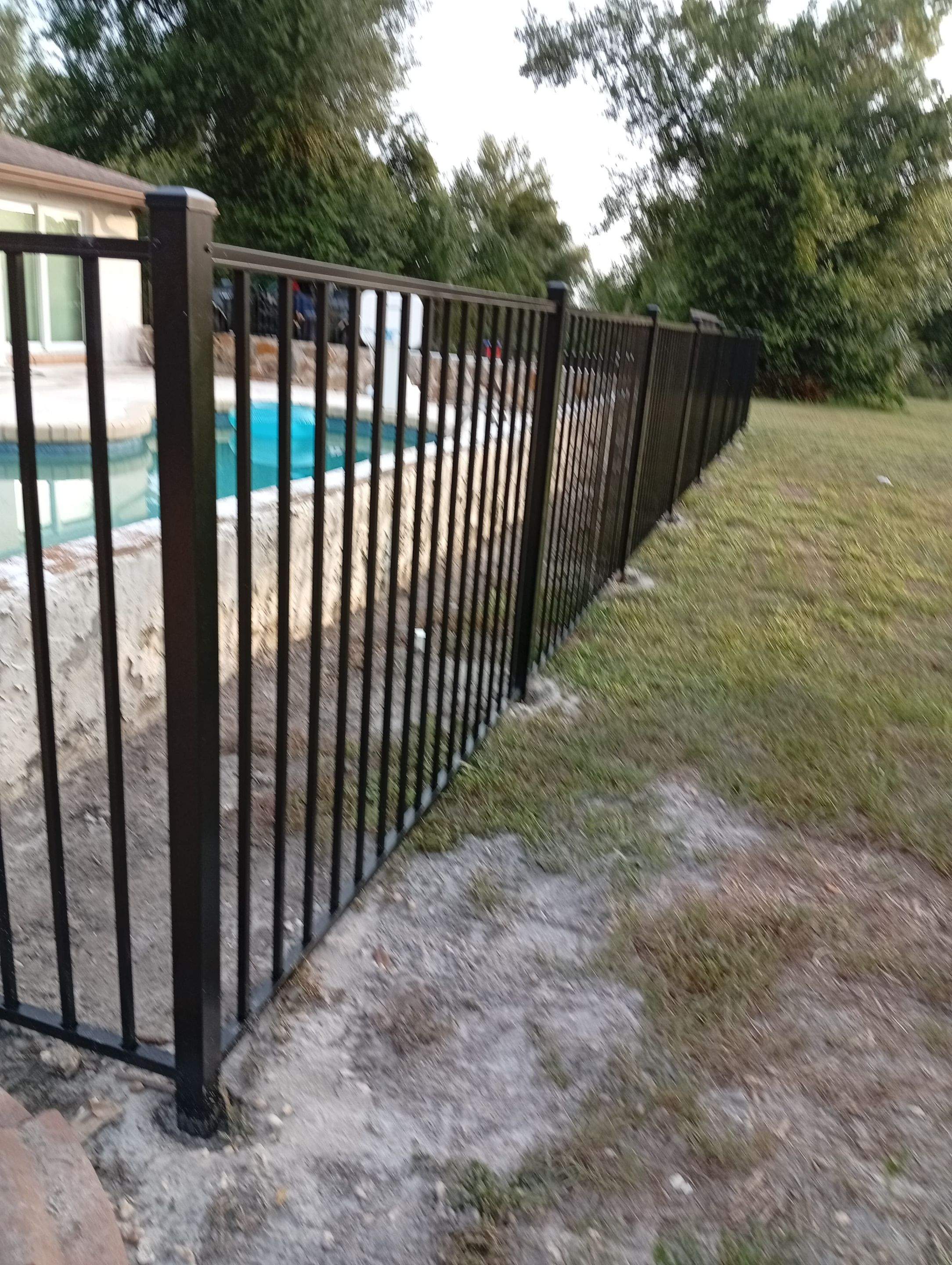 Black Aluminum Pool Safety Fence Installation in Punta Gorda by True Fence LLC