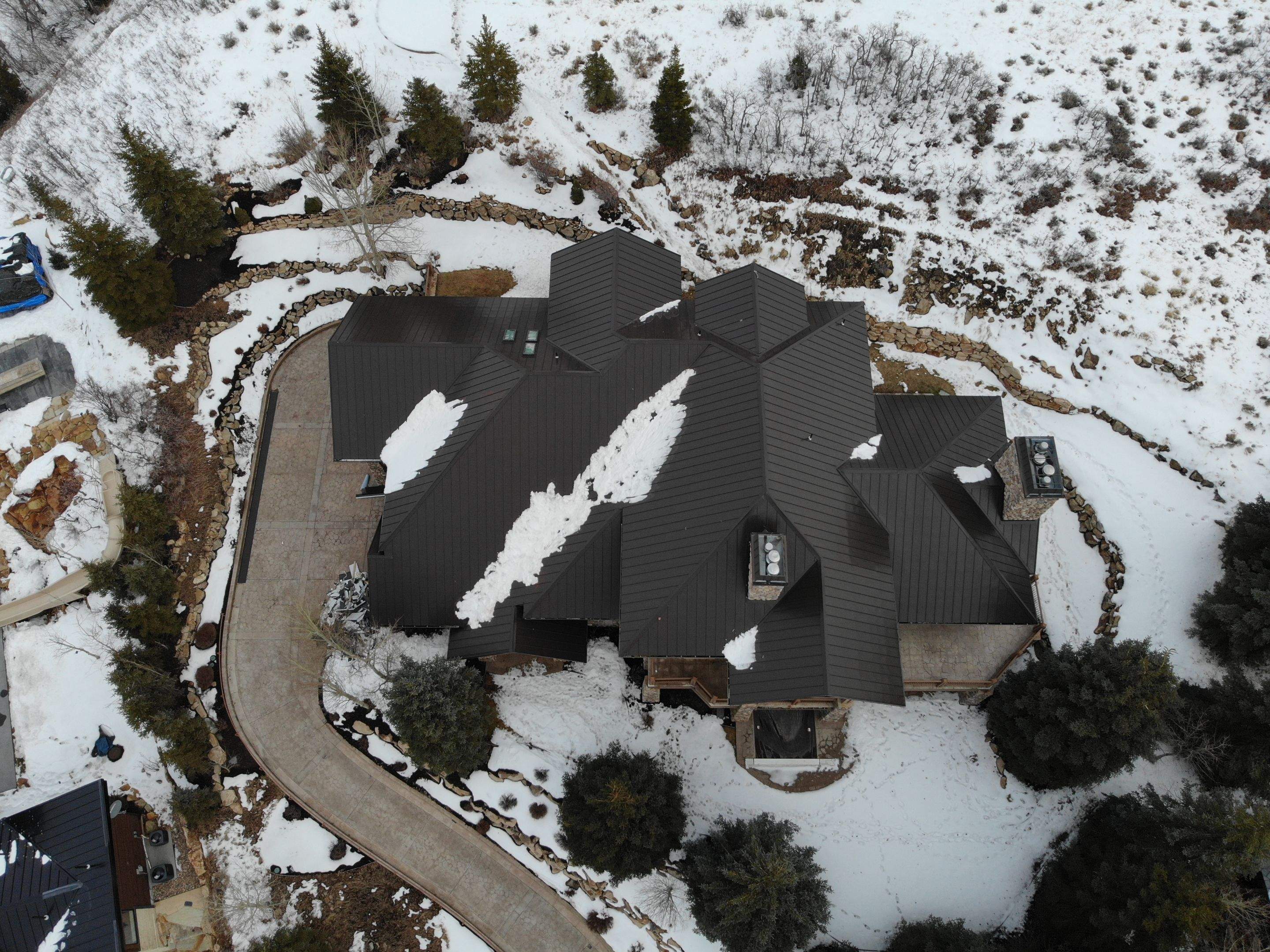 Standing Seam Metal Roof Replacement After Snow Damage by ASAP Roofing & Restoration