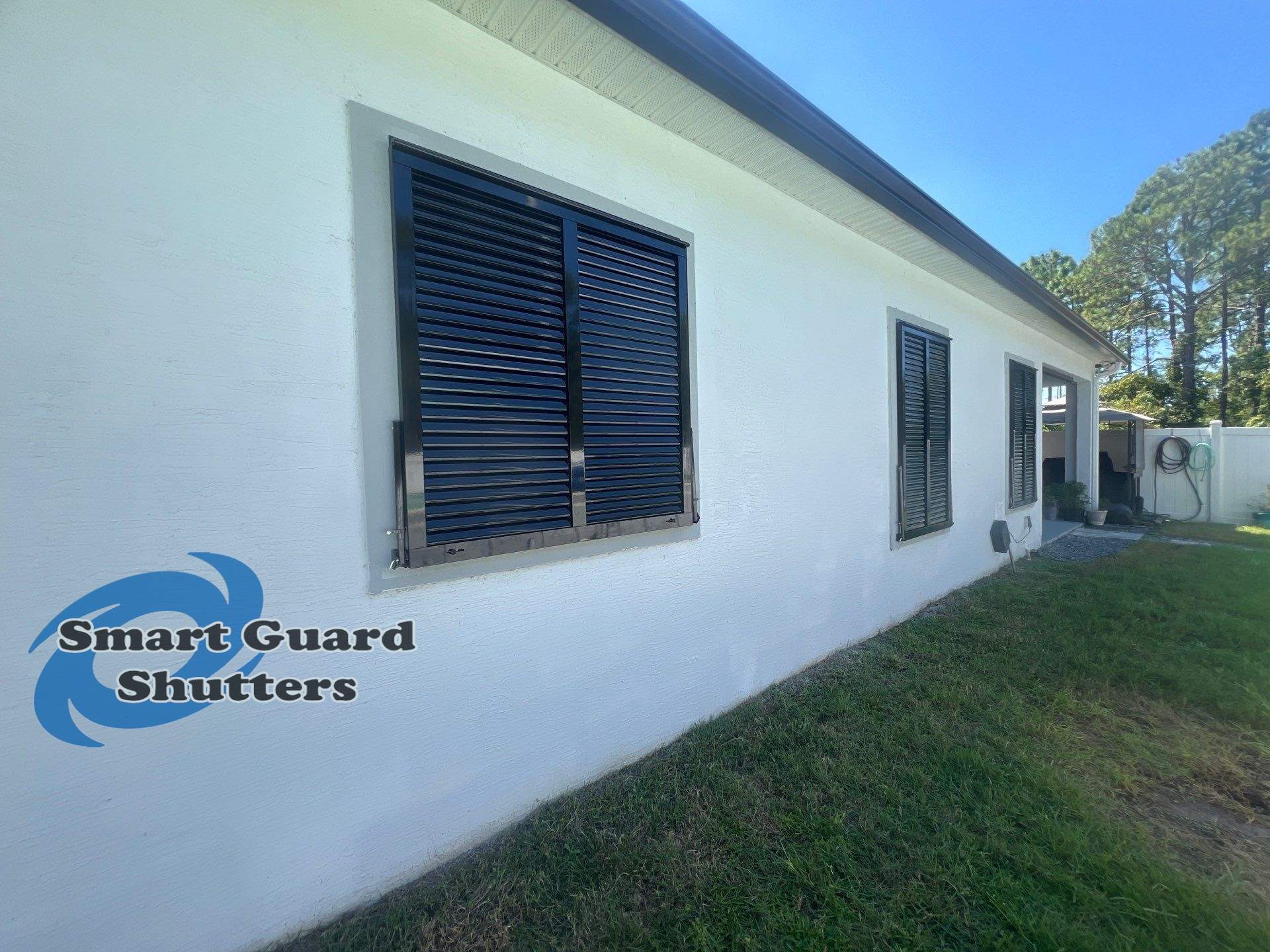 Impact Bahama Shutters in Jet Black by Smart Guard Shutters