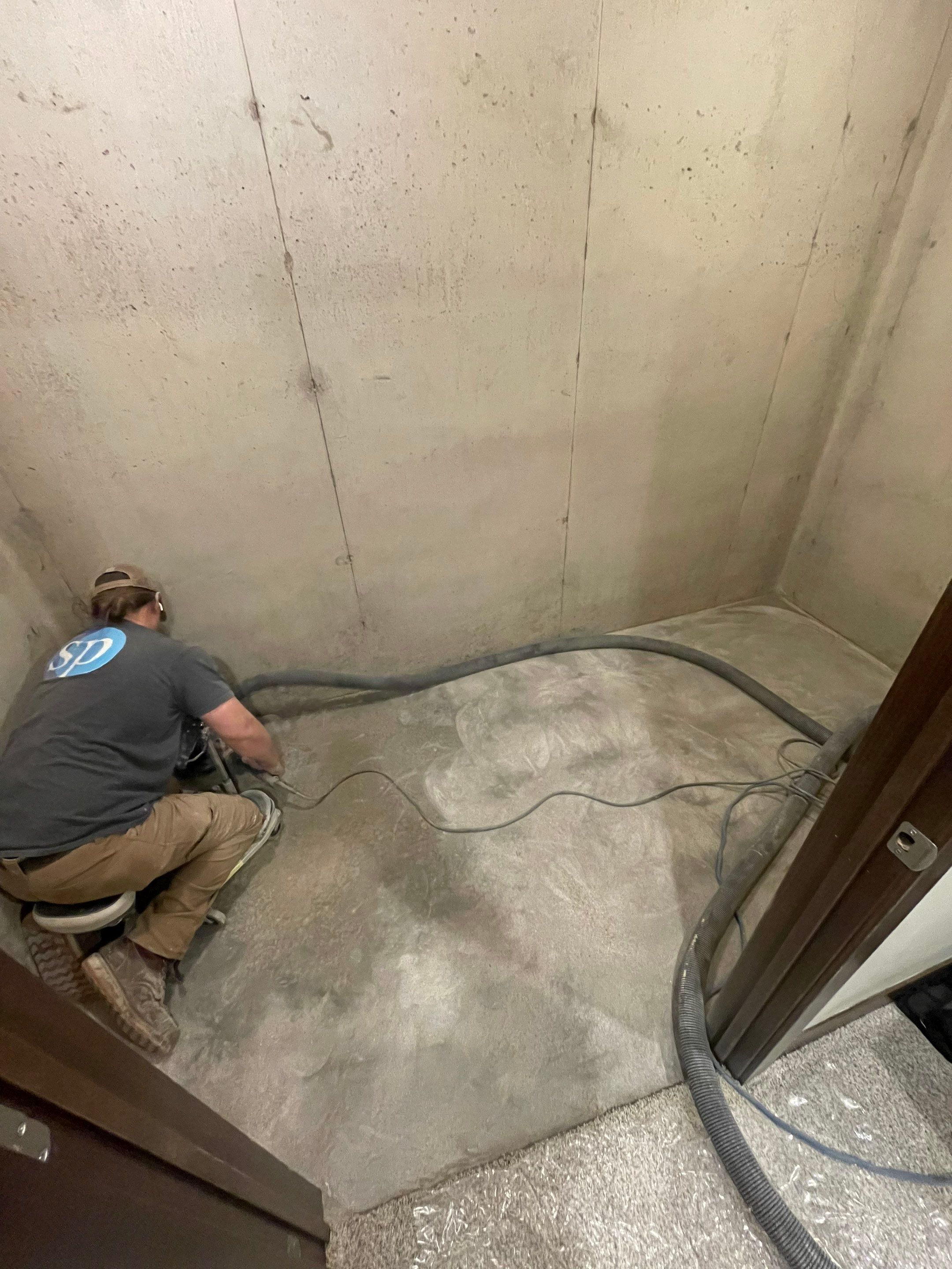 Sioux Falls Basement Floor Transformation with Durable Epoxy Flake Coating by Select Painting, Coatings & Garage Cabinets