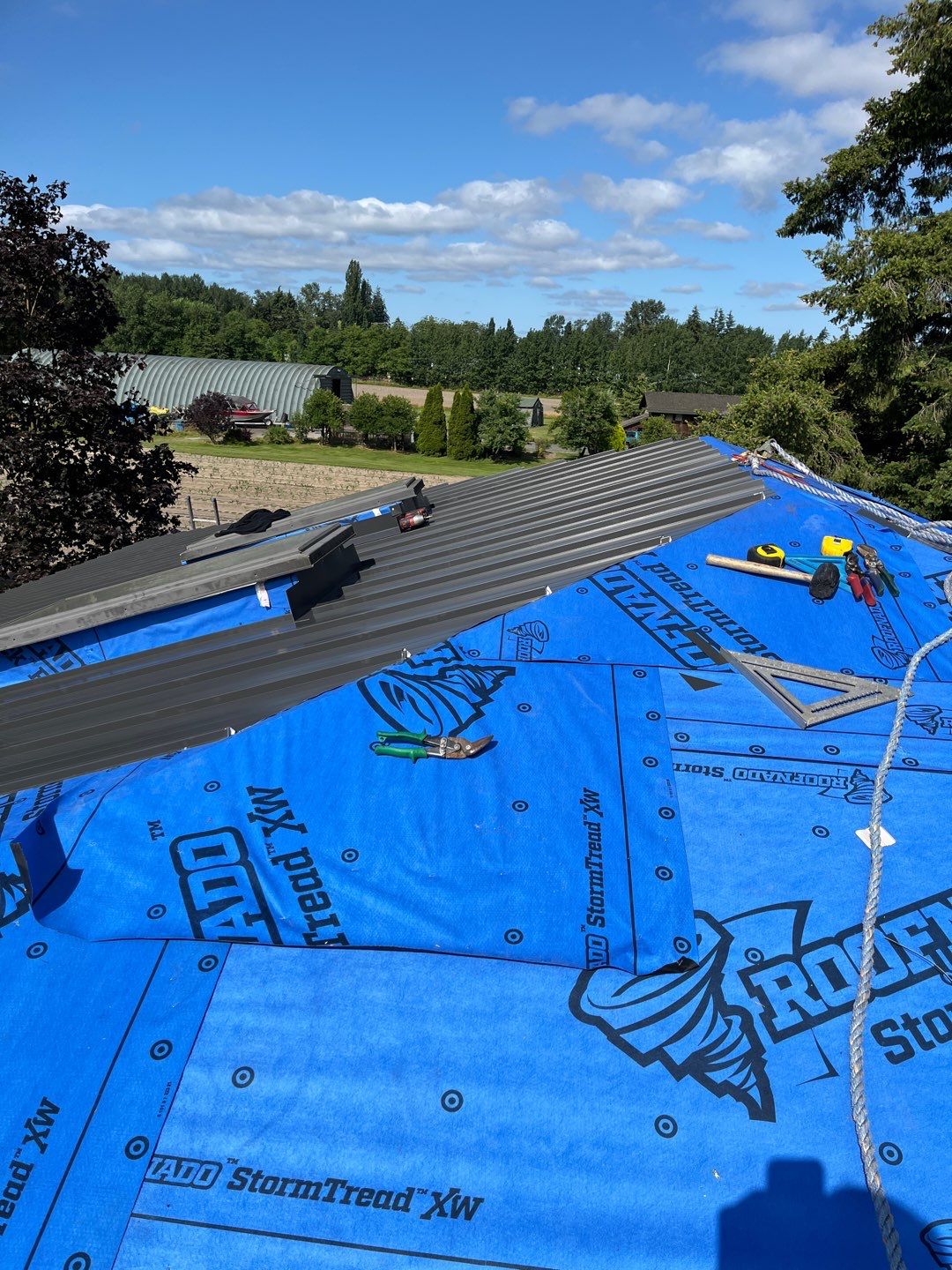 Residential Roofing Installation using 12" Prolok metal  by Top Notch Roofing Inc