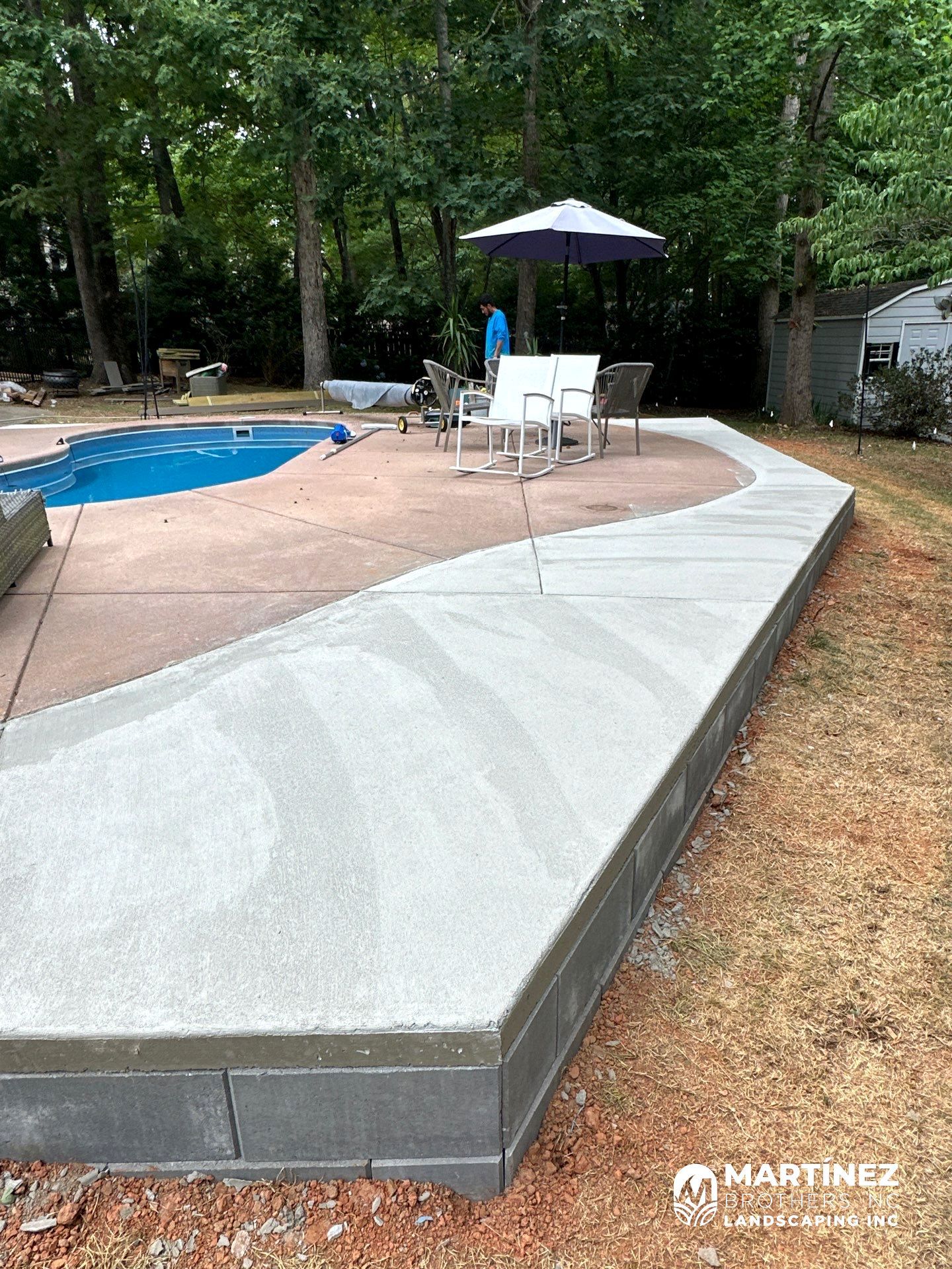 Cool decking pool in Youngsville by Martinez Brother’s Nc Landscaping Inc