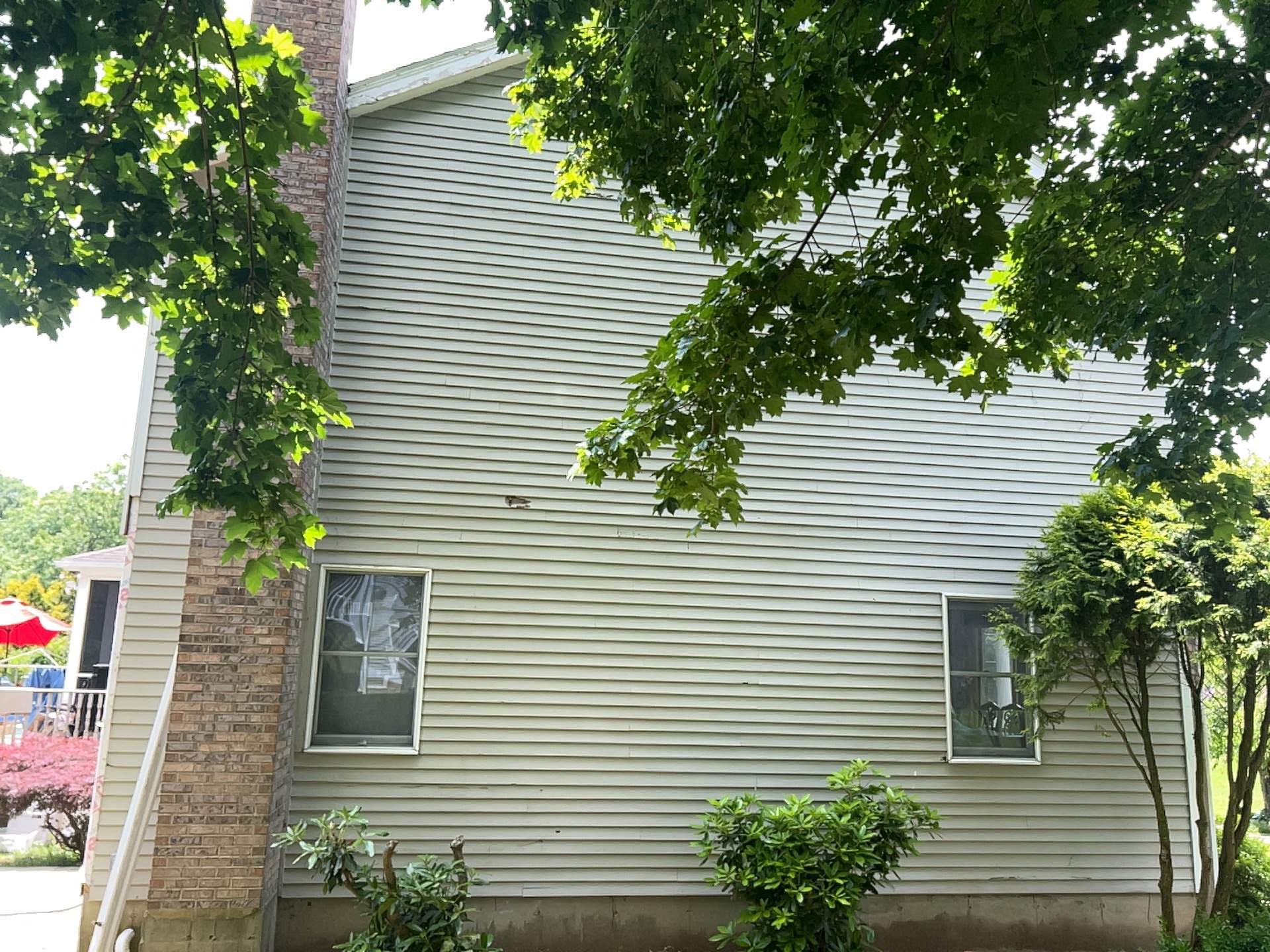 Siding Installation using Mainstreet Colonial & White gutters by A Plus Exterior