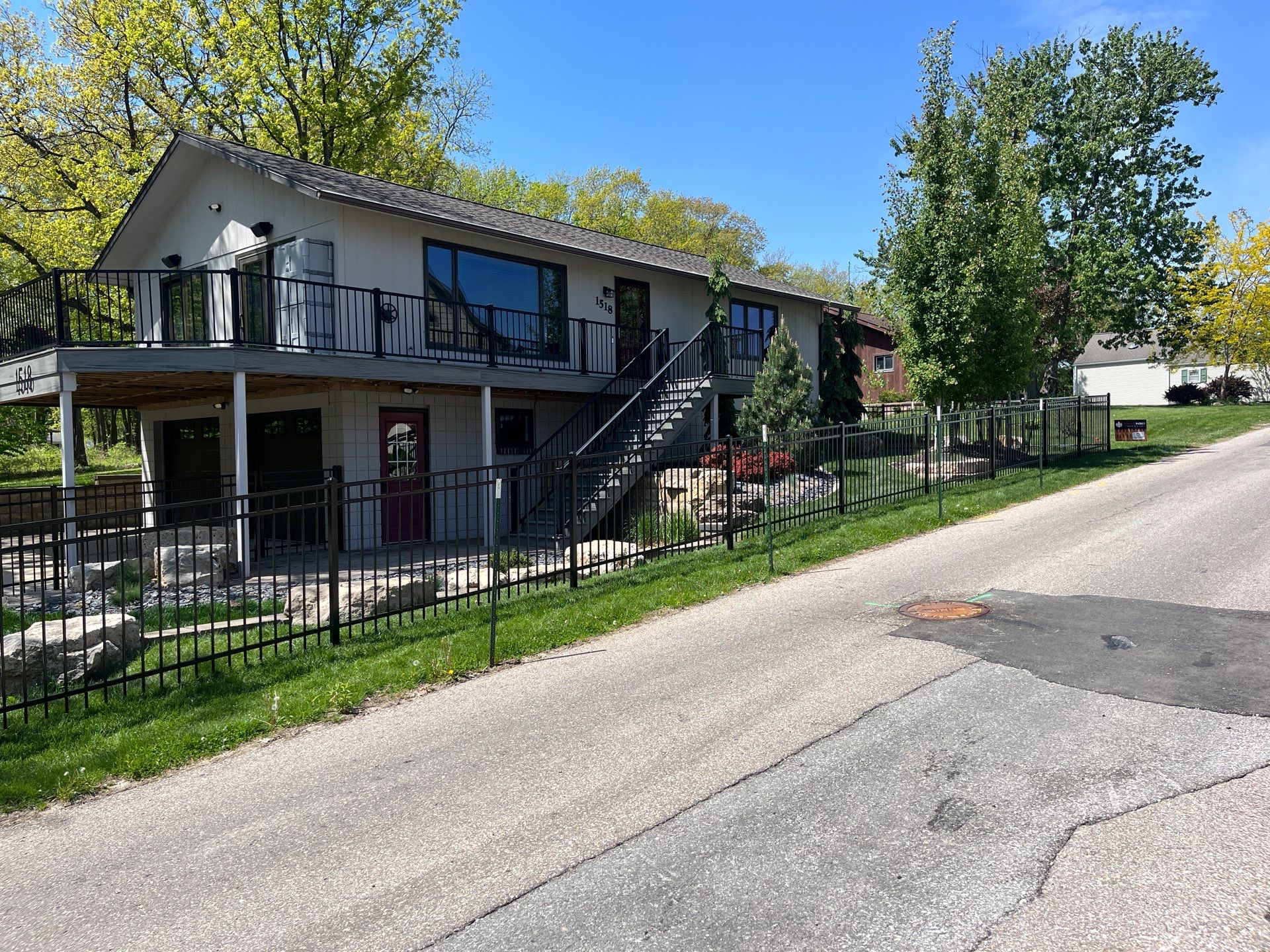 Ornamental Black Metal Picket Fence Installation in Cedar Falls by Perfect Picket Fence and Stain