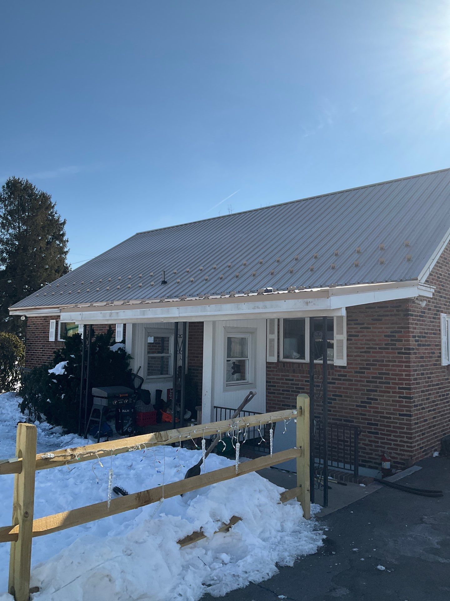Tan Metal Roof and Gutter Replacement for Valley View Home by Esh Builders