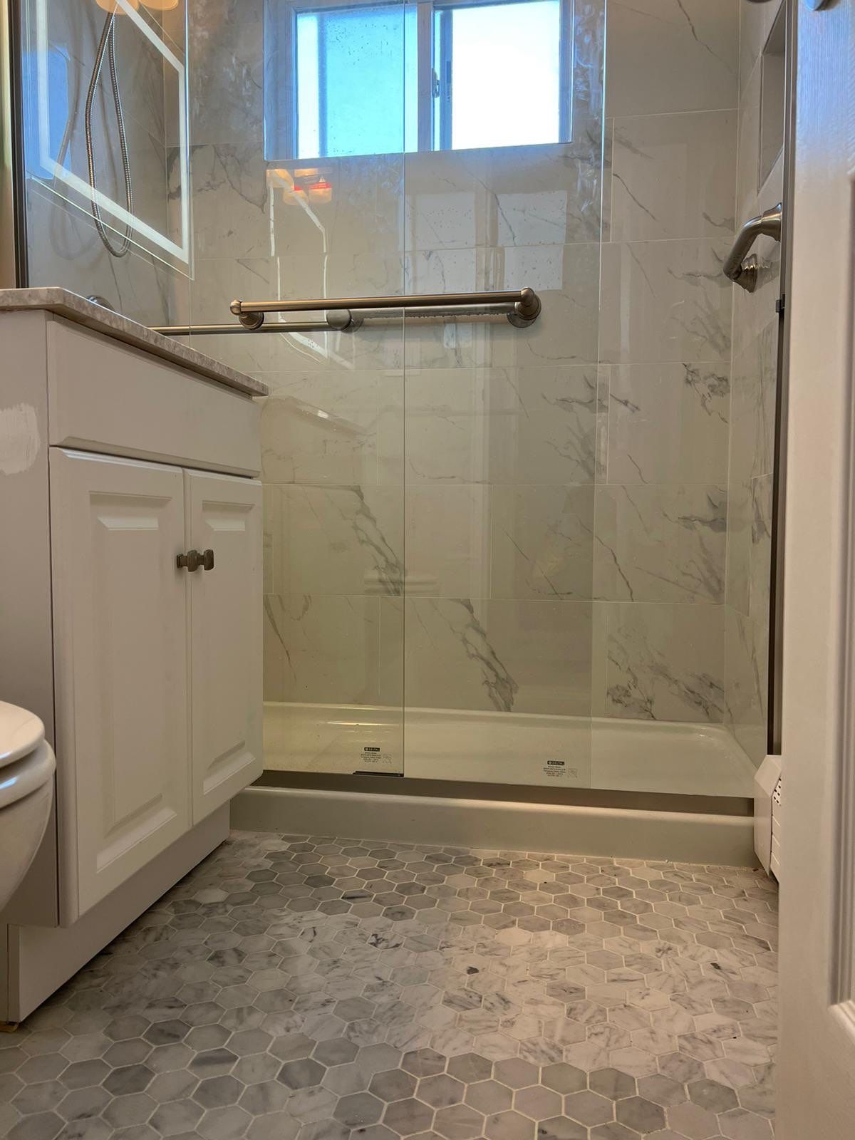 Bathroom Remodel using Tile by Home Concepts Construction