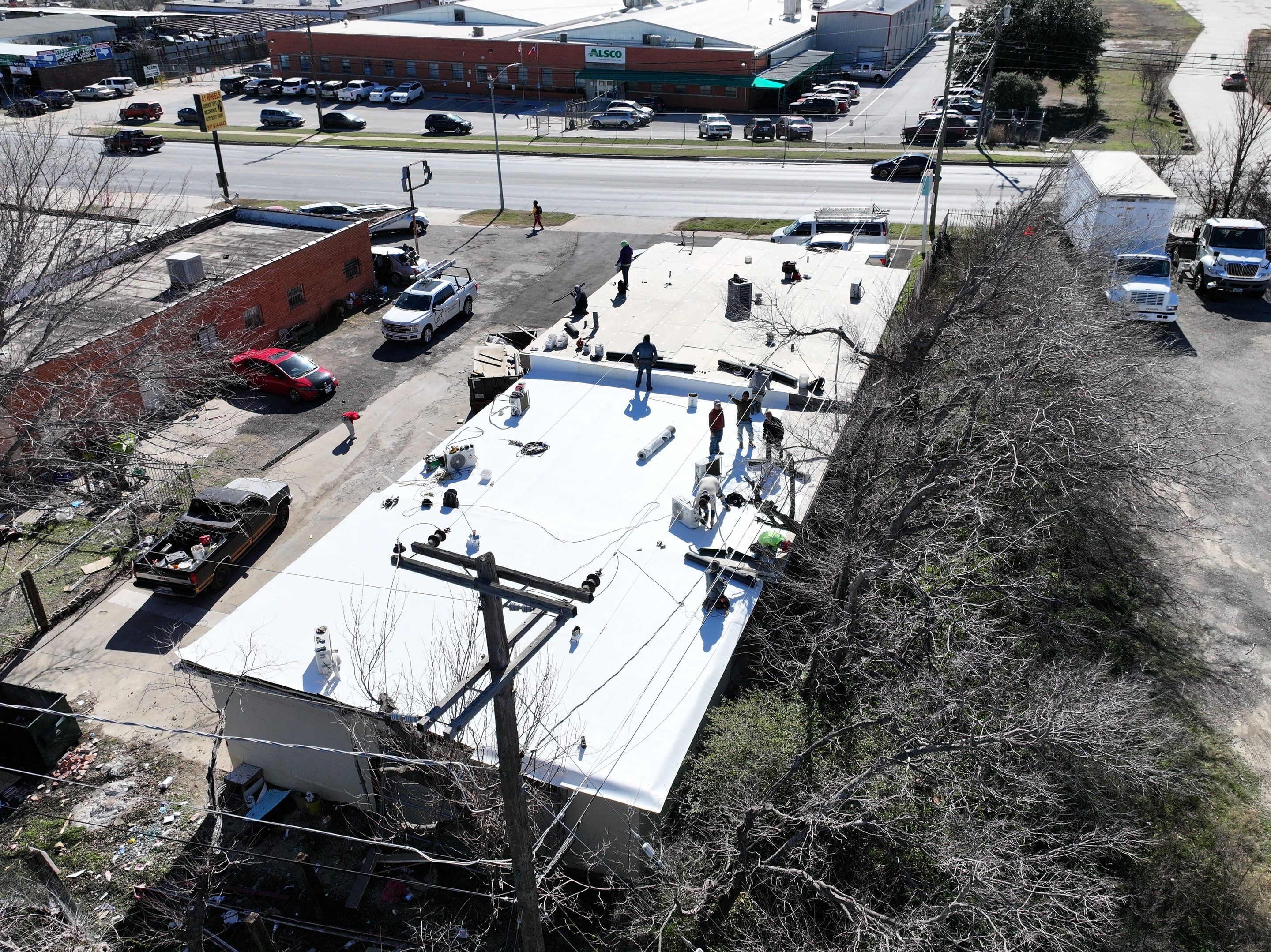 Commercial roofing overlay using GAF TPO over an old ballast roof by Becker Roofing and Exteriors