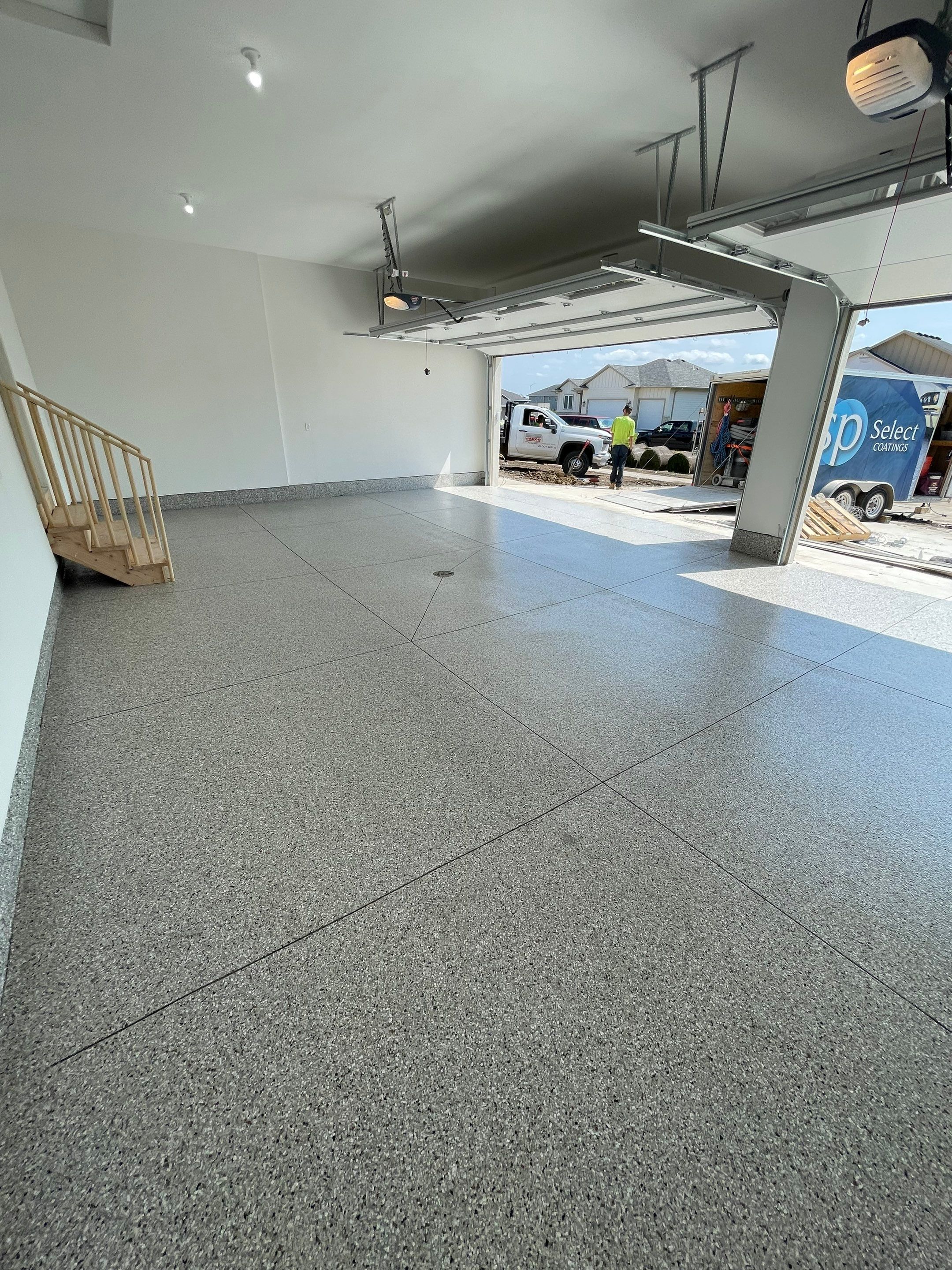 Grey Speckled Garage Floor Coating in Sioux Falls by Select Painting, Coatings & Garage Cabinets