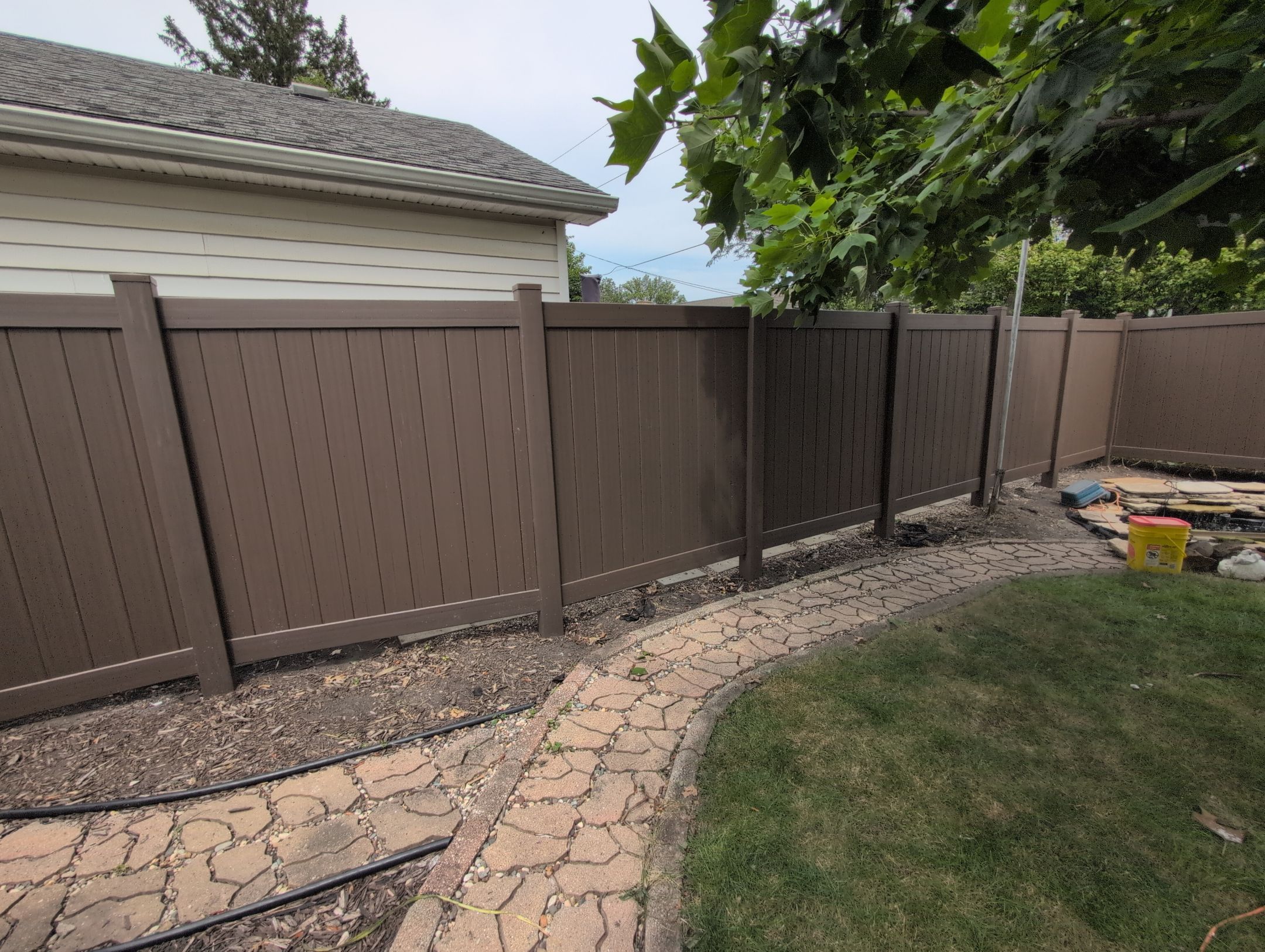 Walnut Vinyl Privacy Fence Installation in Waterloo by Perfect Picket Fence and Stain