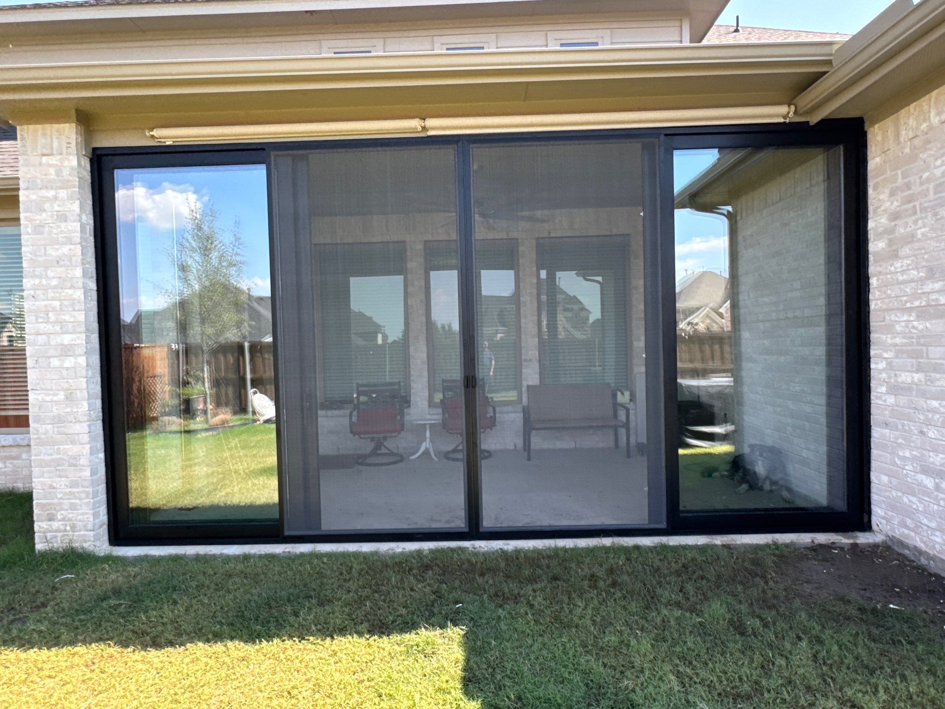 Year-Round Bonus Room: Patio Enclosure Featuring 16ft Seamless Sliding Glass by Tibi Soli LLC