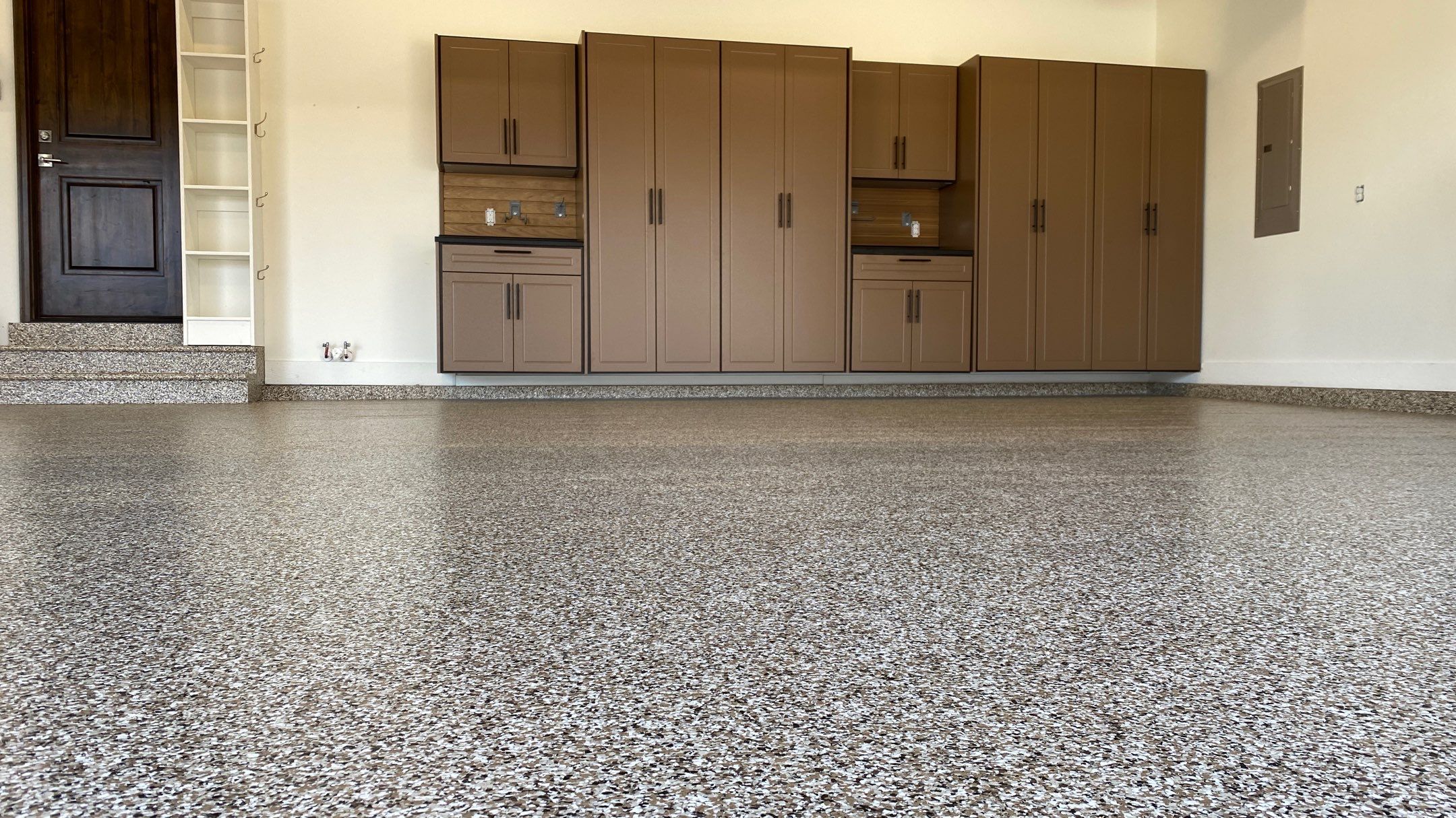 Kenny & Debbie transformed their garage with a Banner Garage Floor and cabinets by Banner Garage