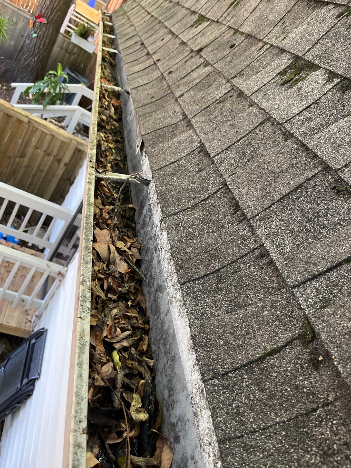 Commercial gutter cleaning Clarksville, TN before photo with filled gutters