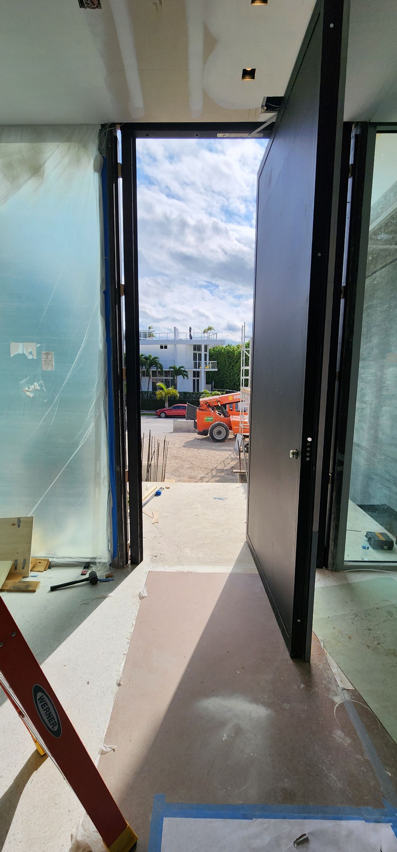 Door Installation using FBS Hurricane Certified Pivot Door by FBS Systems Inc