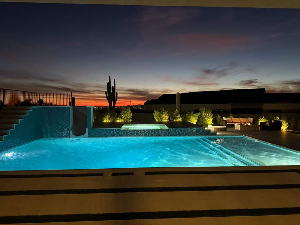 Pool and spa build with slide & outdoor kitchen by Modern Pools