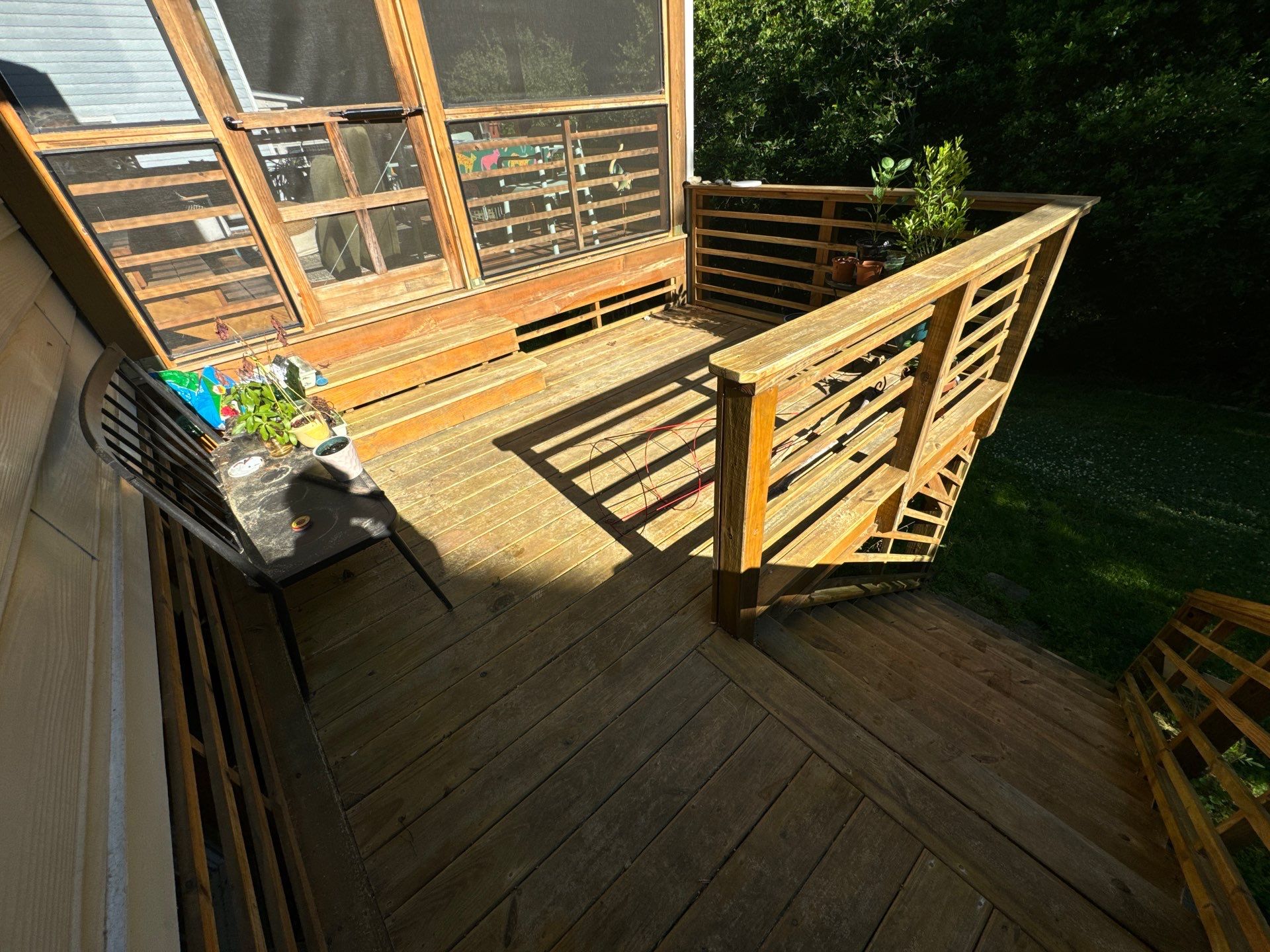 Porch staining by GonzalezPainters & Contractors Inc 