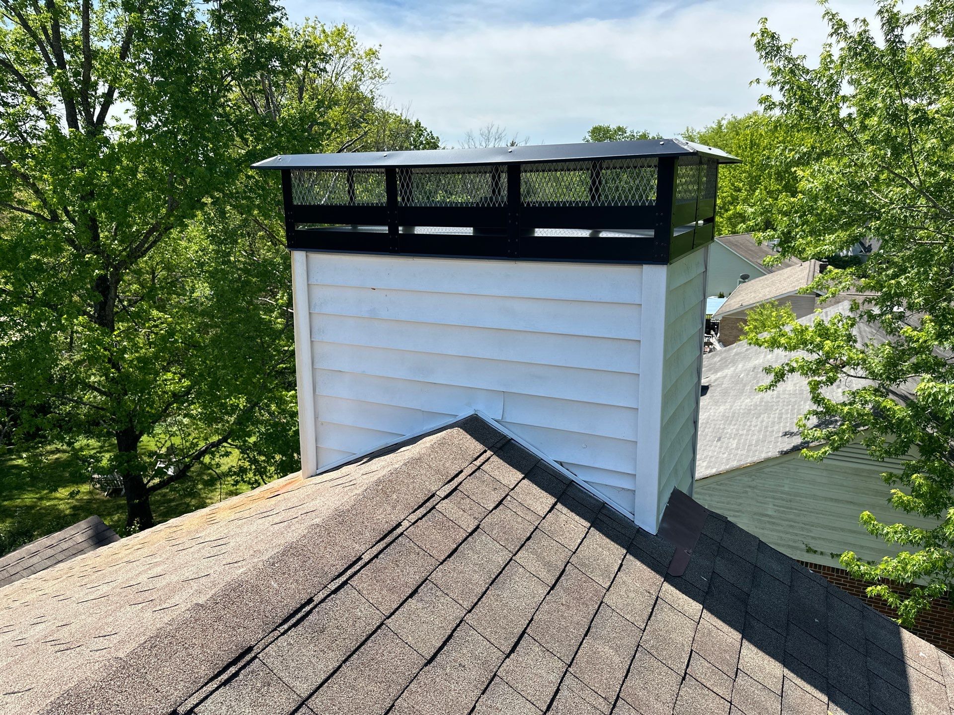 Residential Roofing Repair using Custom Fabricated Chimney Cap by Paragon Roofing