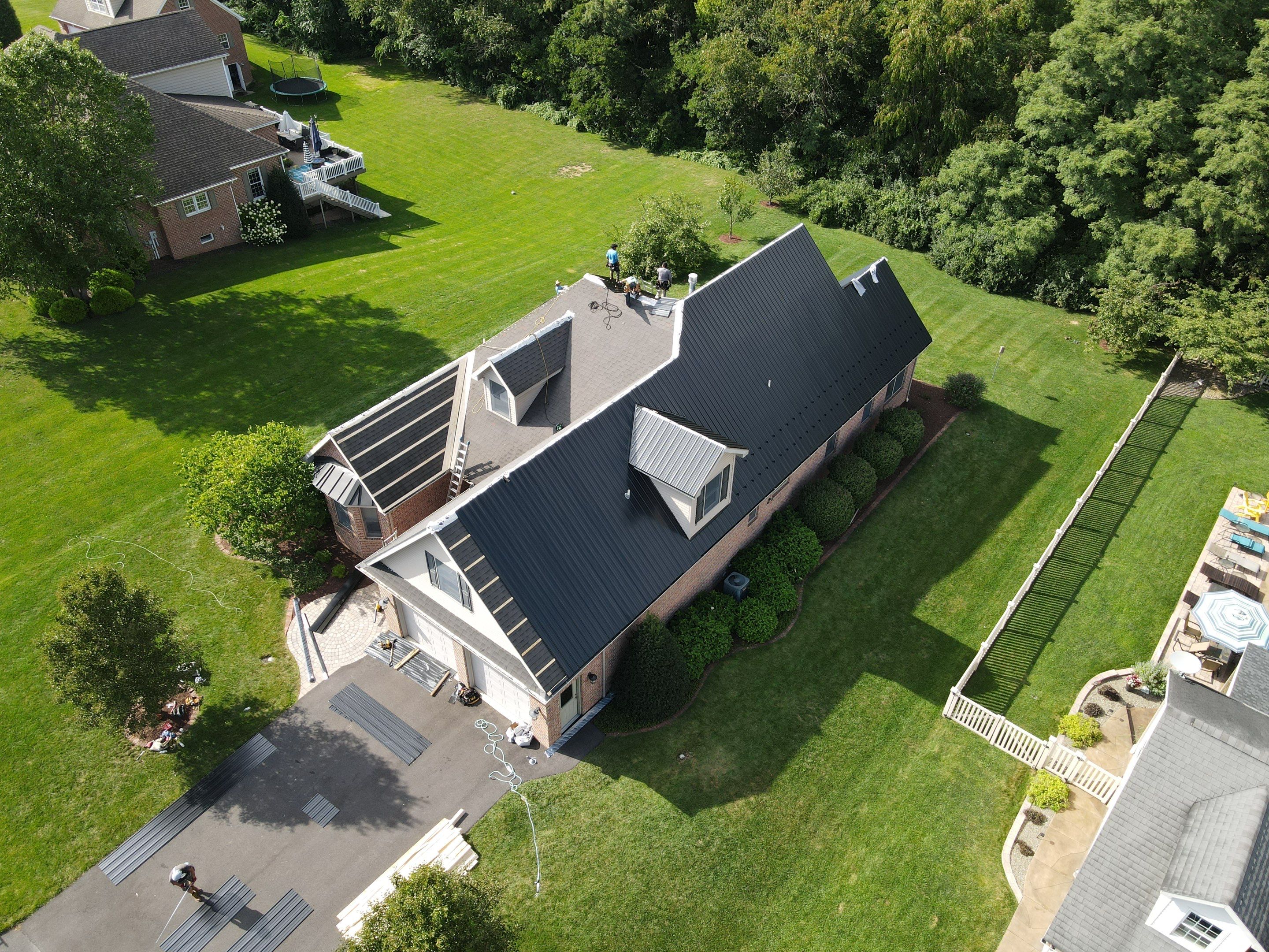 Standing seam / Azm panel in black  by Teflon Roofing