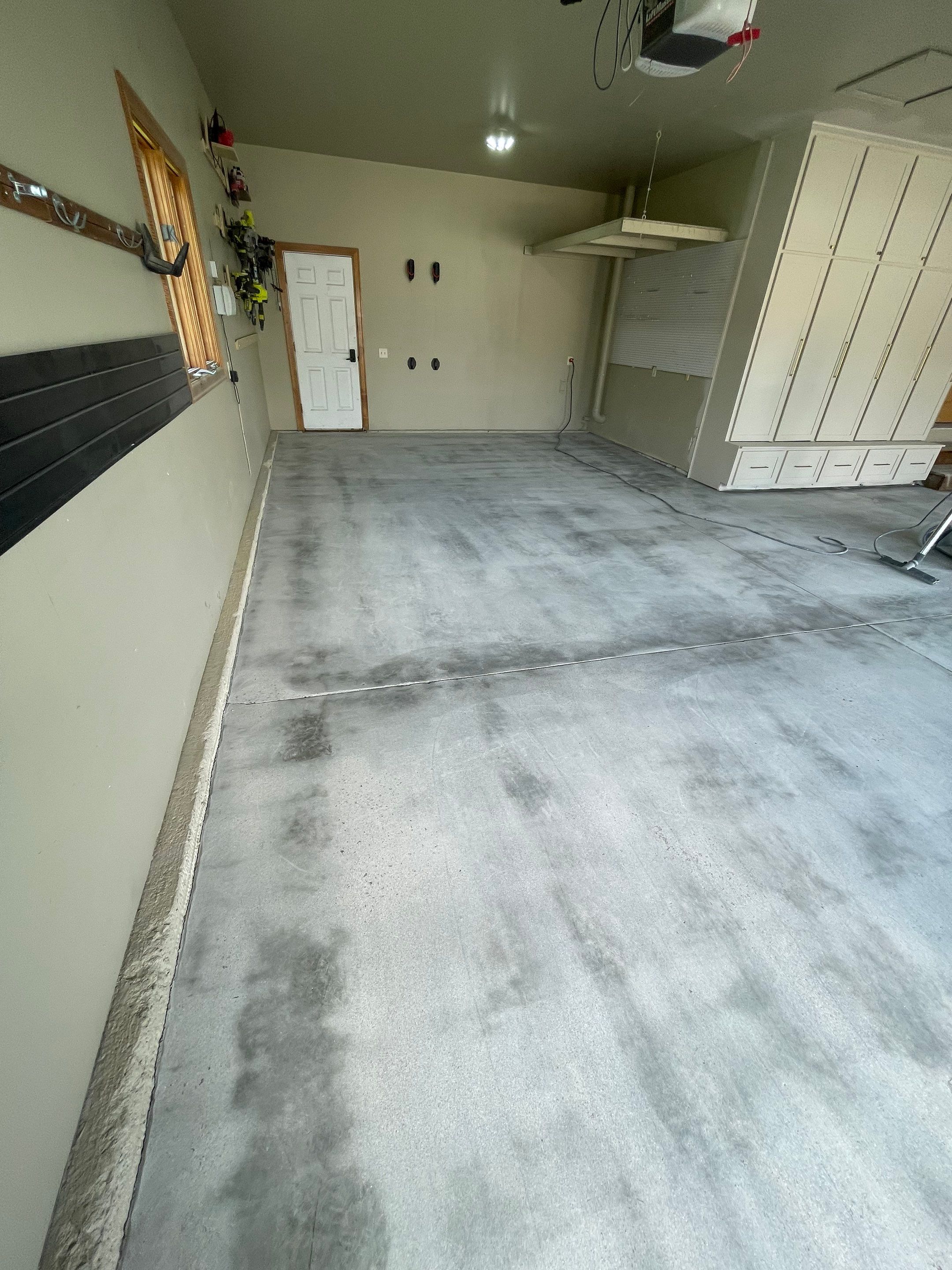 Cabin FEver Flake Garage Floor Coating Installation in Sioux Falls by Select Painting, Coatings & Garage Cabinets