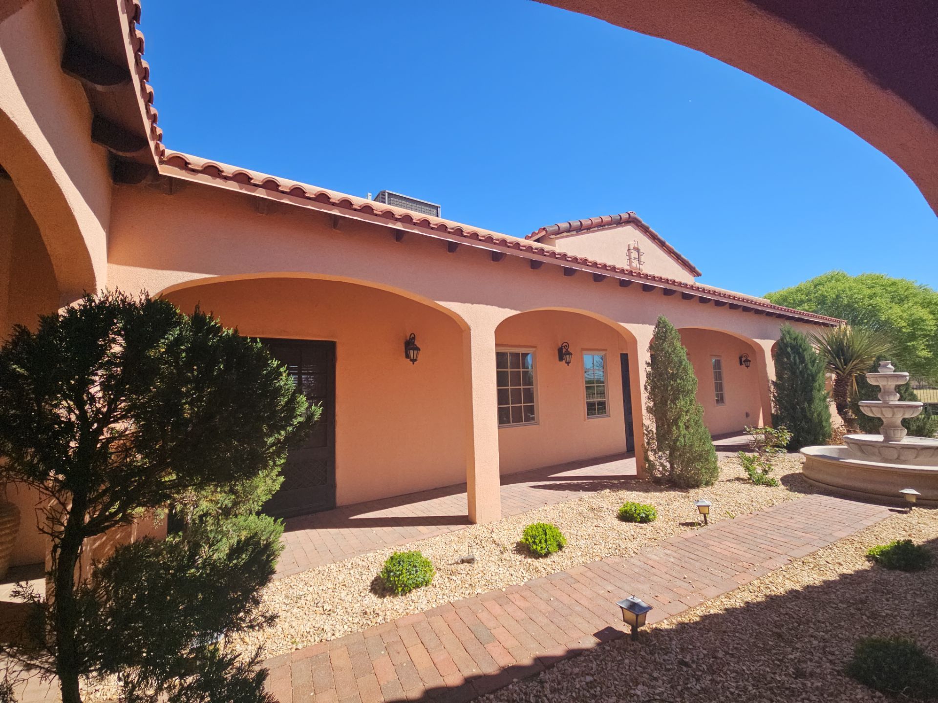 Exterior Painting with Stucco Damage by Regal Renovate