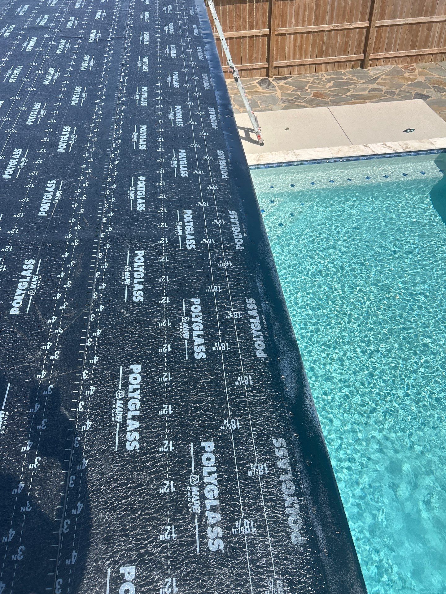 Patio Pool Cover by Bayfront Roofing and Construction
