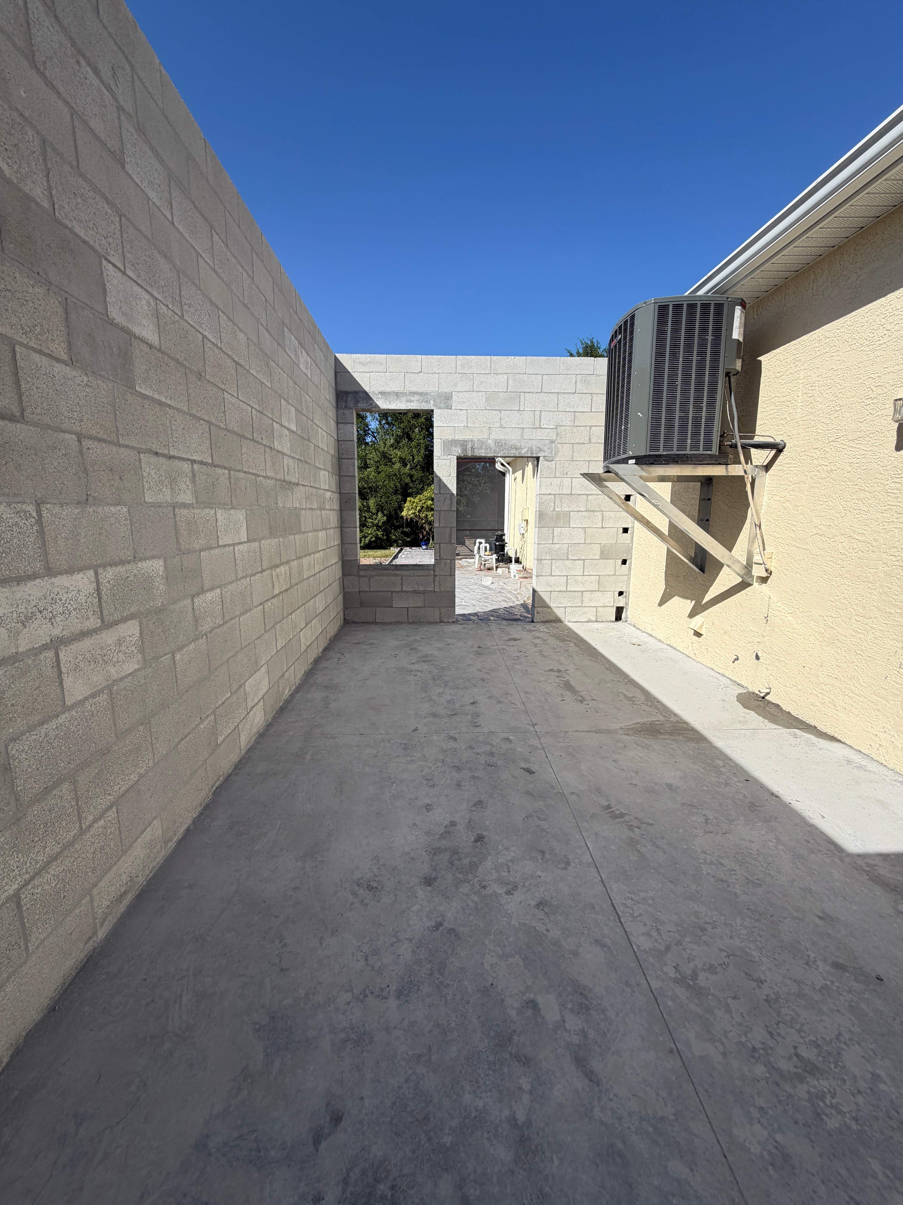 Custom Single-Car Garage Addition and Lanai Cage in Bradenton by Vertical General Contracting 
