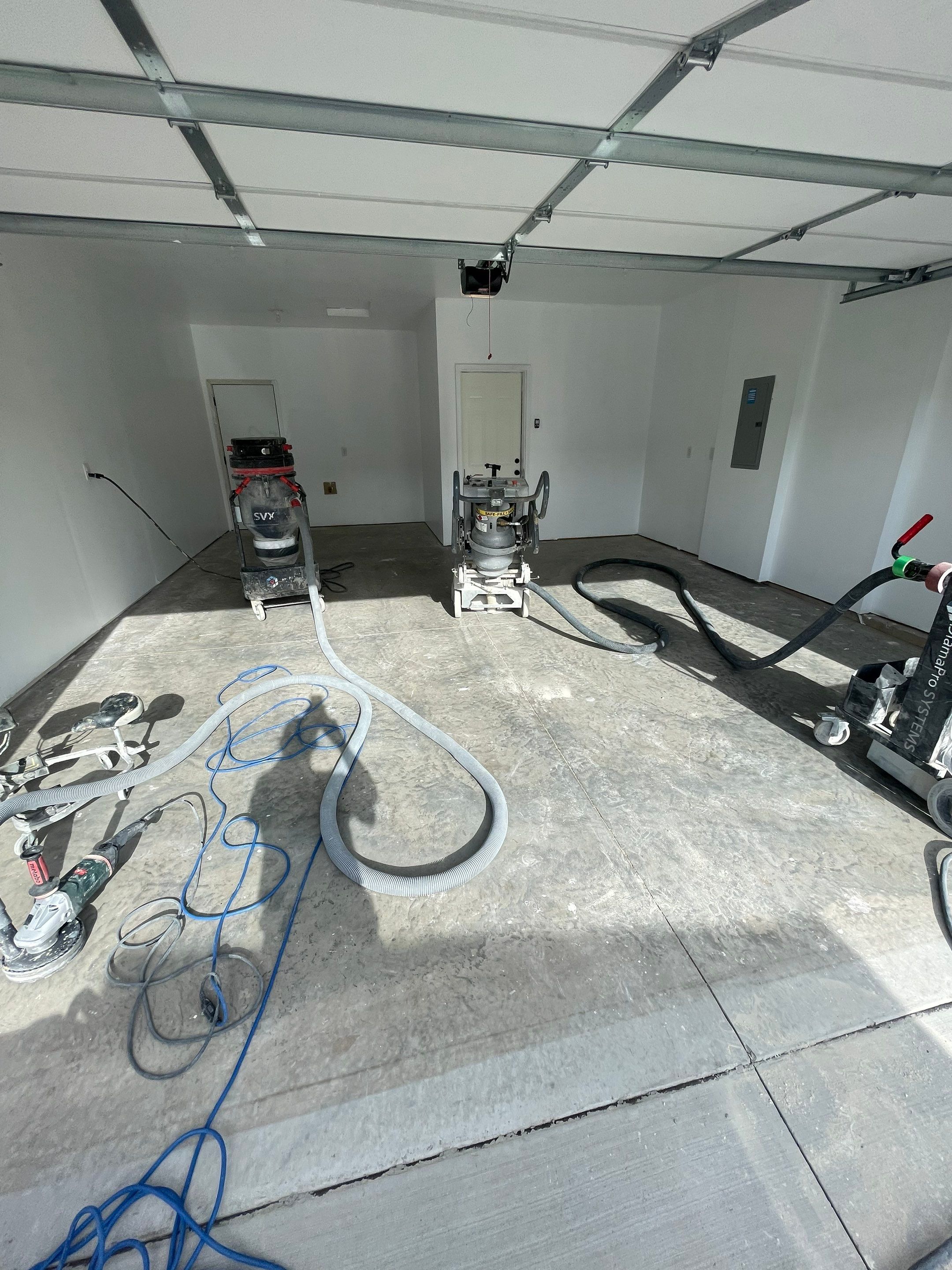 Sioux Falls Garage Floor Transformation with Cabin Fever Decorative Chips by Select Painting, Coatings & Garage Cabinets