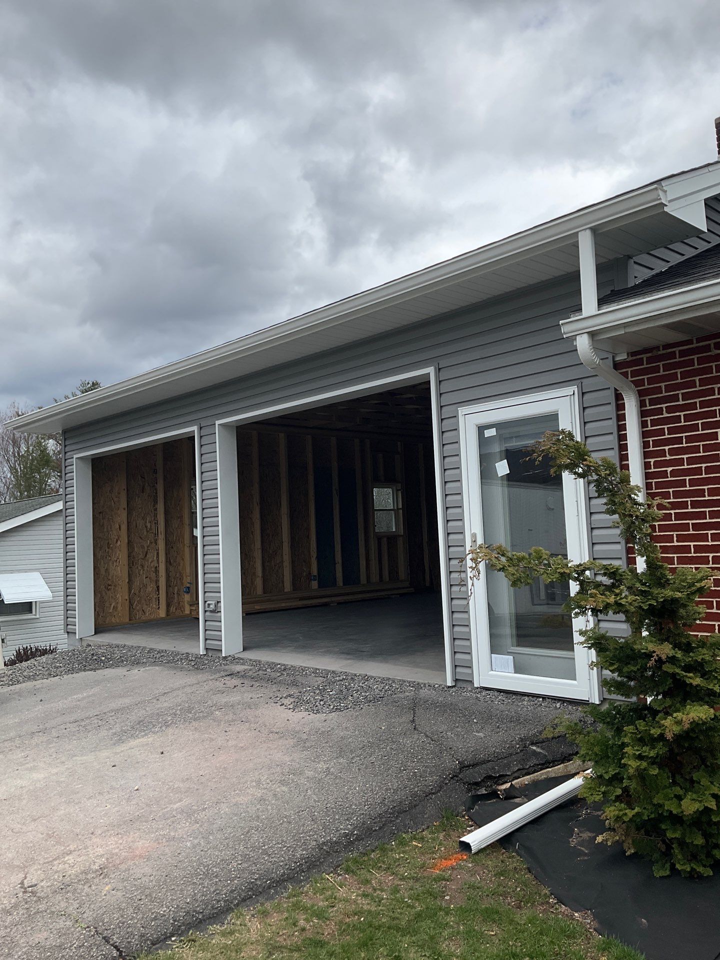 Tower City Residential Addition Featuring Gray Vinyl Siding and Garage by Esh Builders