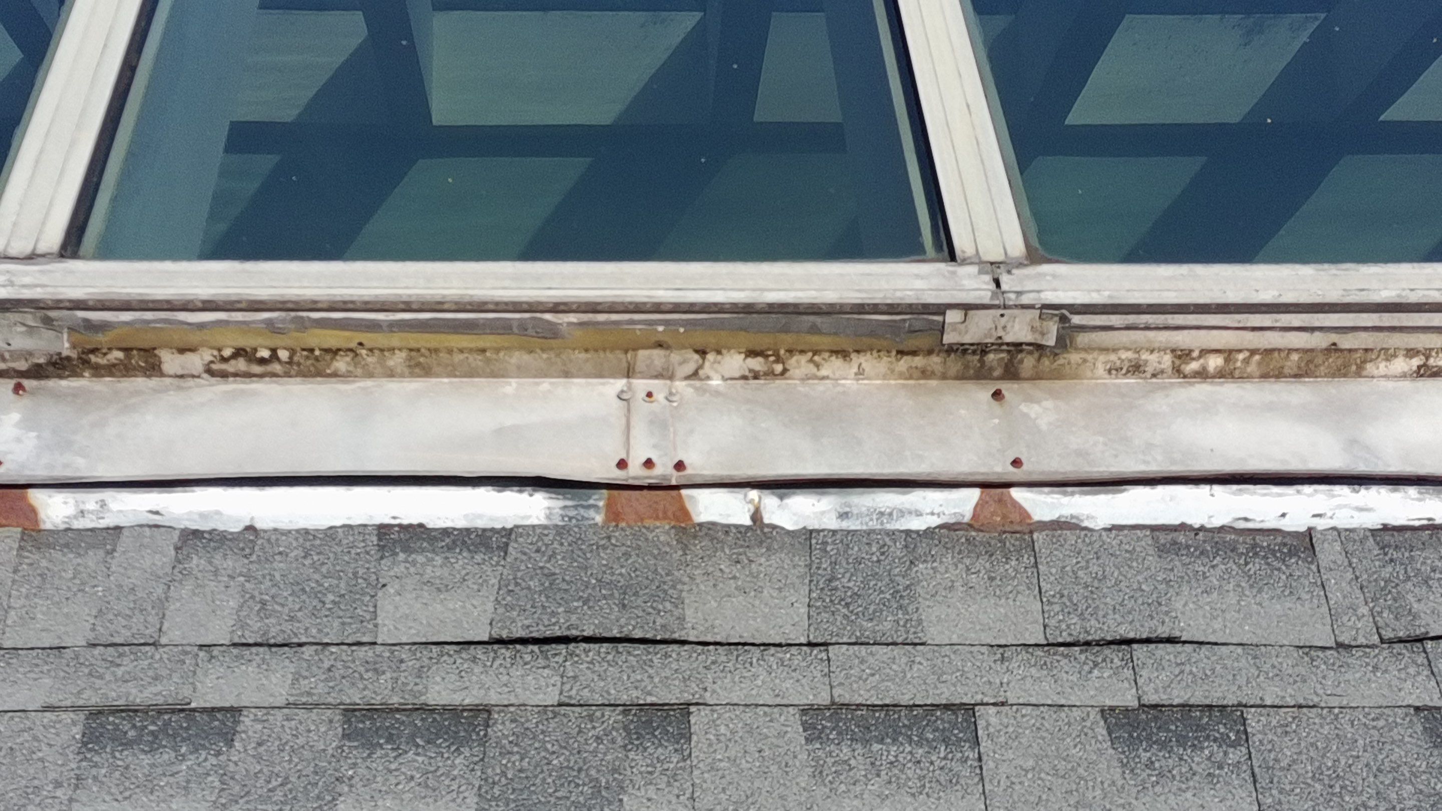 Ridge Skylight Repair and Shingle Roof Maintenance in Winter Park by Fortified Roofing Solutions Corp.