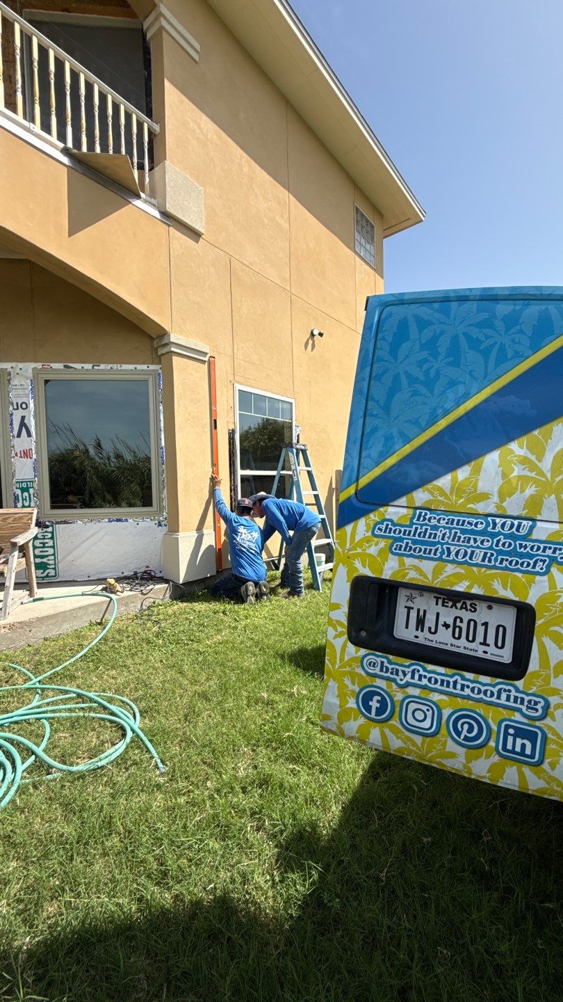Installing Windows on a Submarine  by Bayfront Roofing and Construction