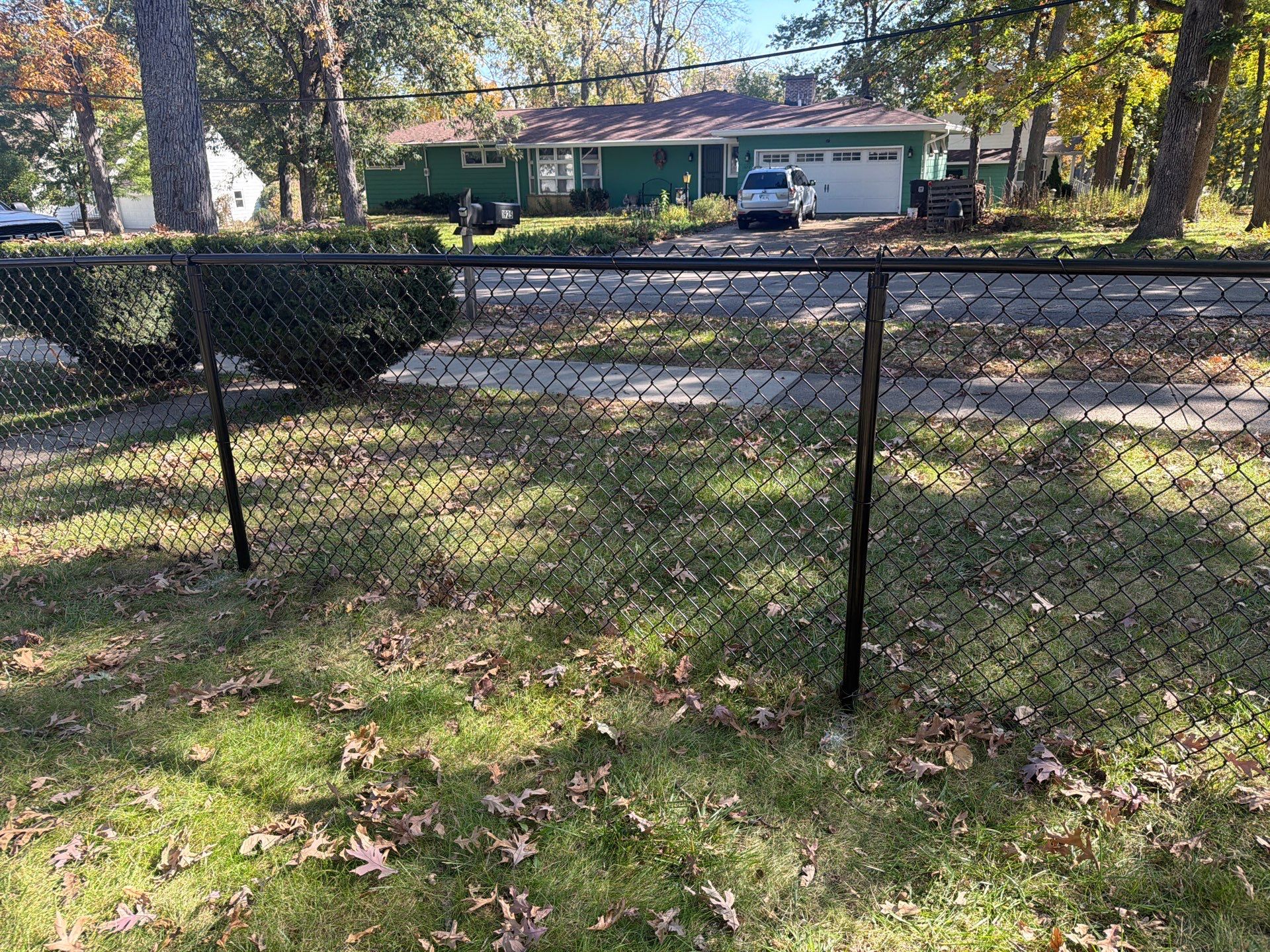 Residential Black Chain Link Fencing in Cedar Falls by Perfect Picket Fence and Stain