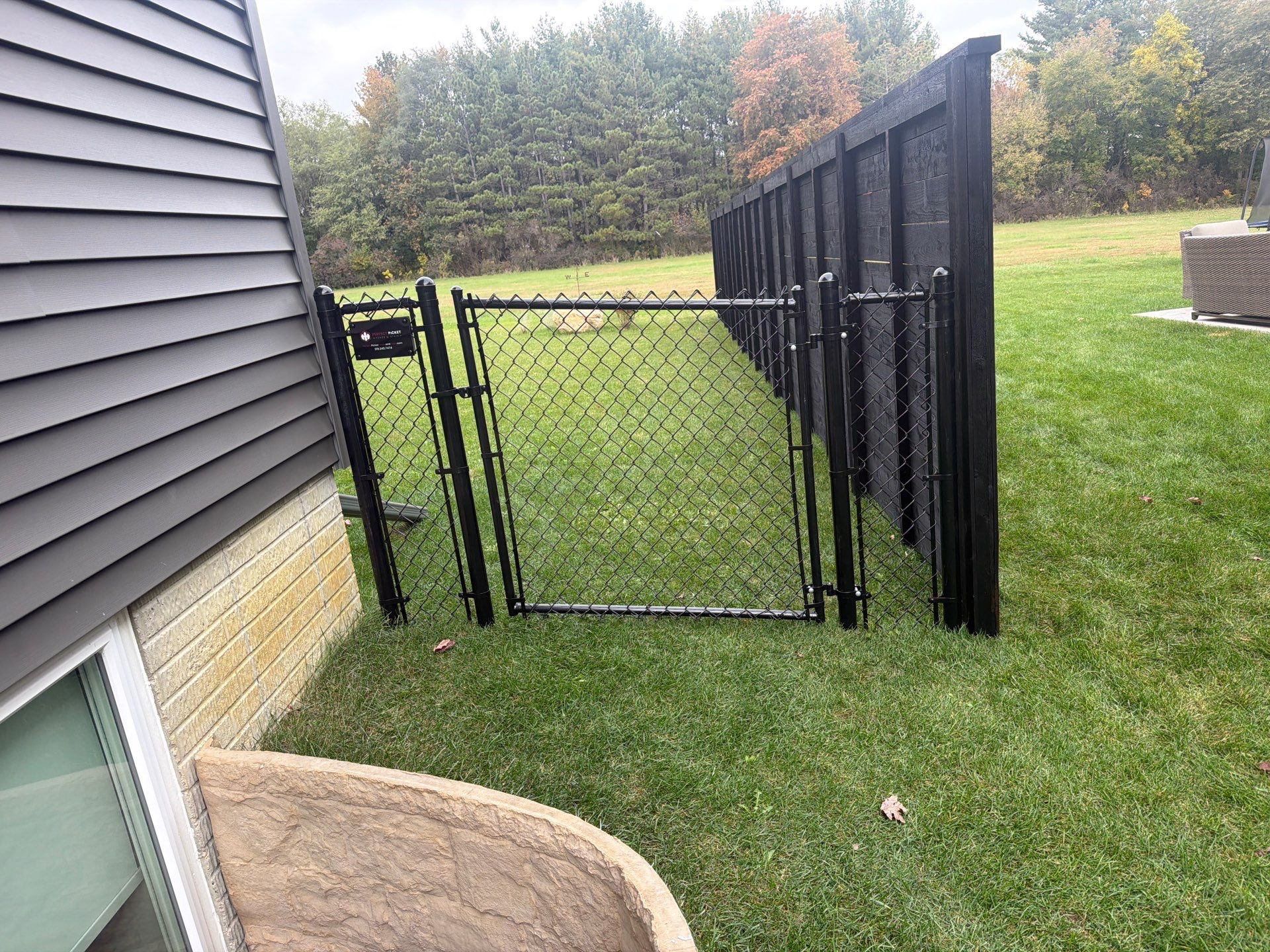 Modern Horizontal Wood Privacy Fence Installation in Cedar Falls by Perfect Picket Fence and Stain
