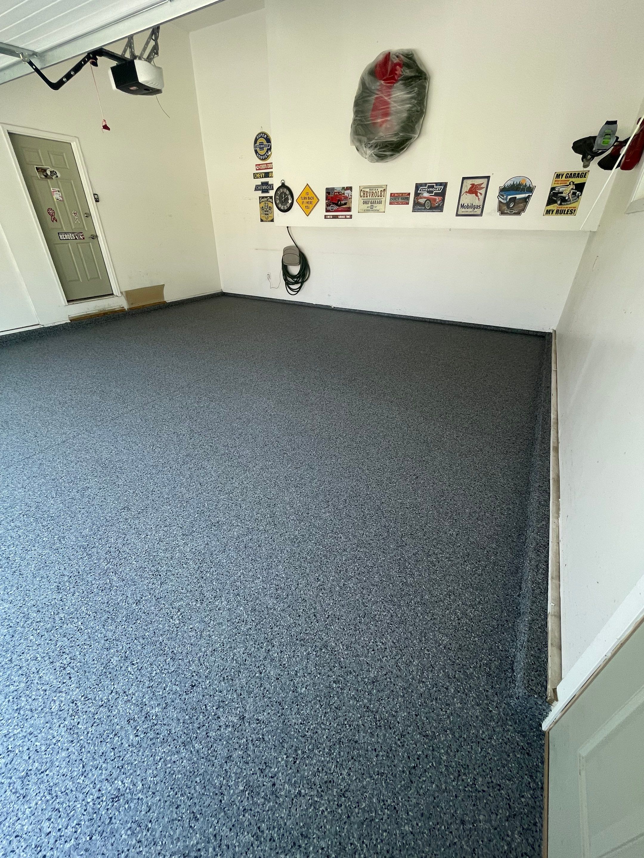 Sioux Falls Garage Floor Coating with Nightfall Decorative Chips by Select Painting, Coatings & Garage Cabinets