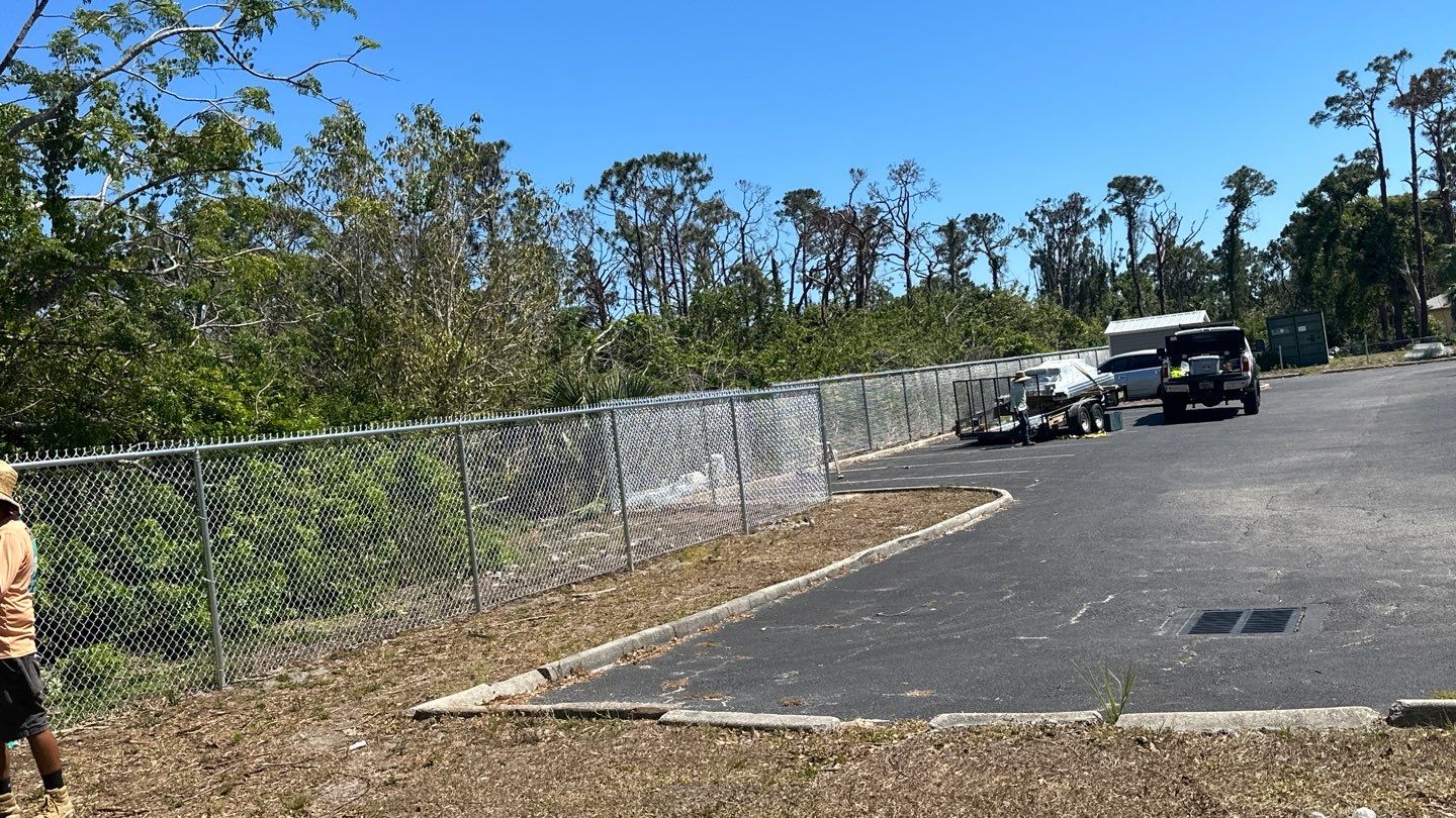 Commercial Chainlink and Vinyl Fence With Aluminum Framed Gates On Dumpster Enclosure by Asap fence and gates, LLC