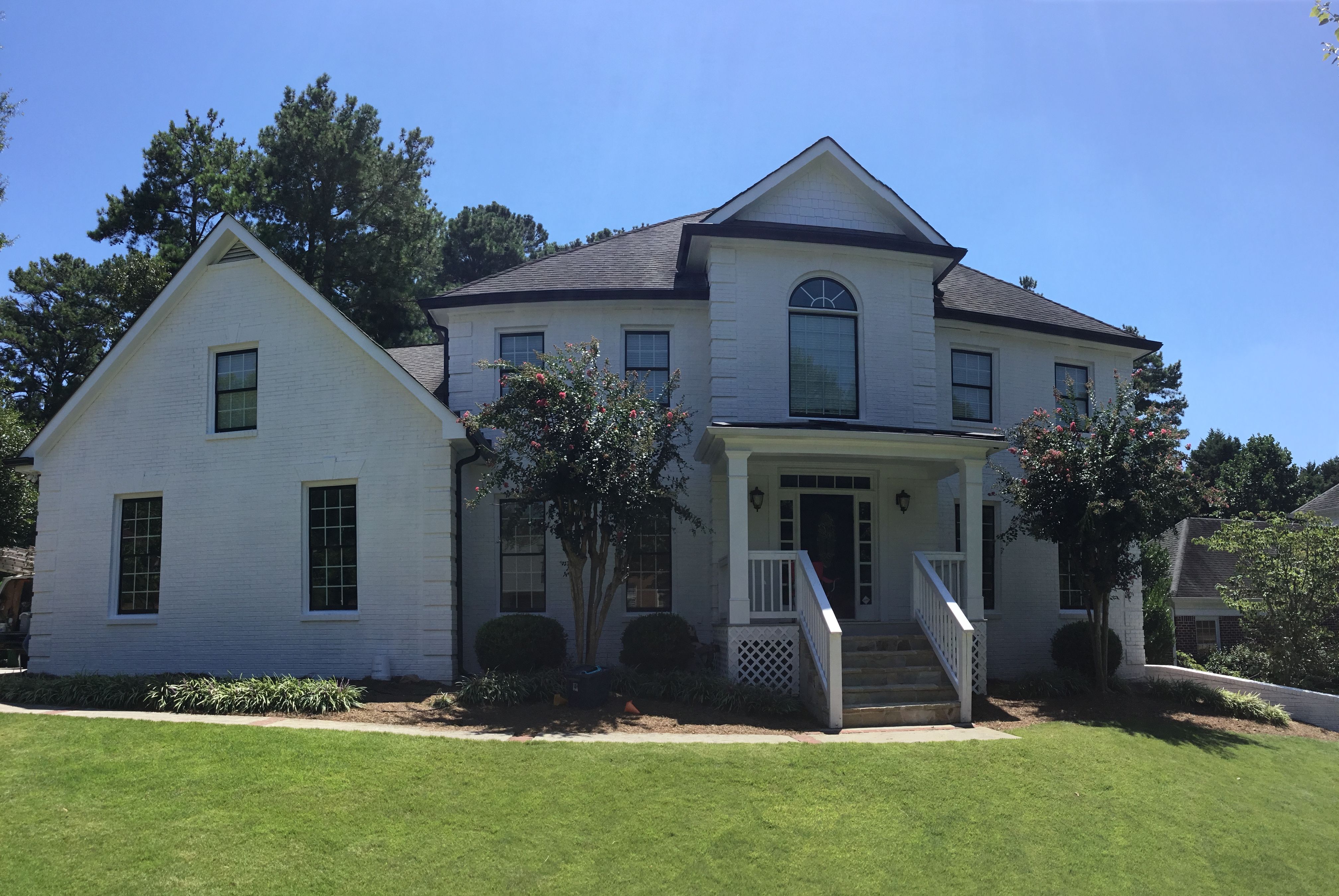 Custom Front Porch Construction with White Railing in Dunwoody by Swift Home Renovations