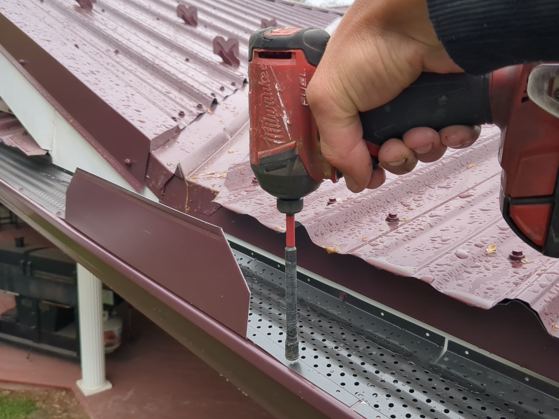 Maroon ABM Metal Roof Replacement and Gutter Installation in Shenandoah by Esh Builders