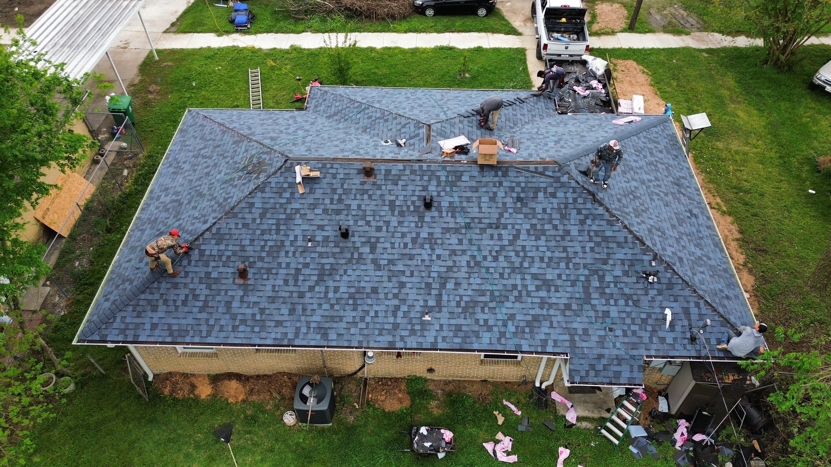 Houston Residential Roof Replacement Using Harbor Blue Architectural Shingles by Houston Roofing & Construction
