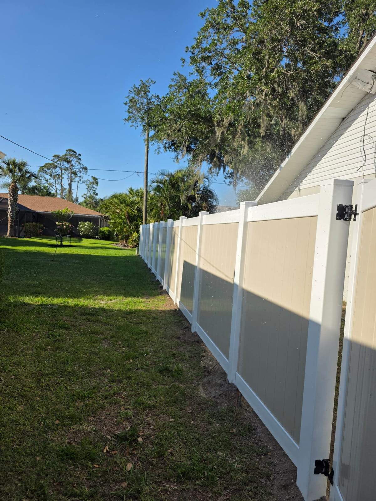 Two-Tone Vinyl Privacy Fence Installation in Port Charlotte by True Fence LLC